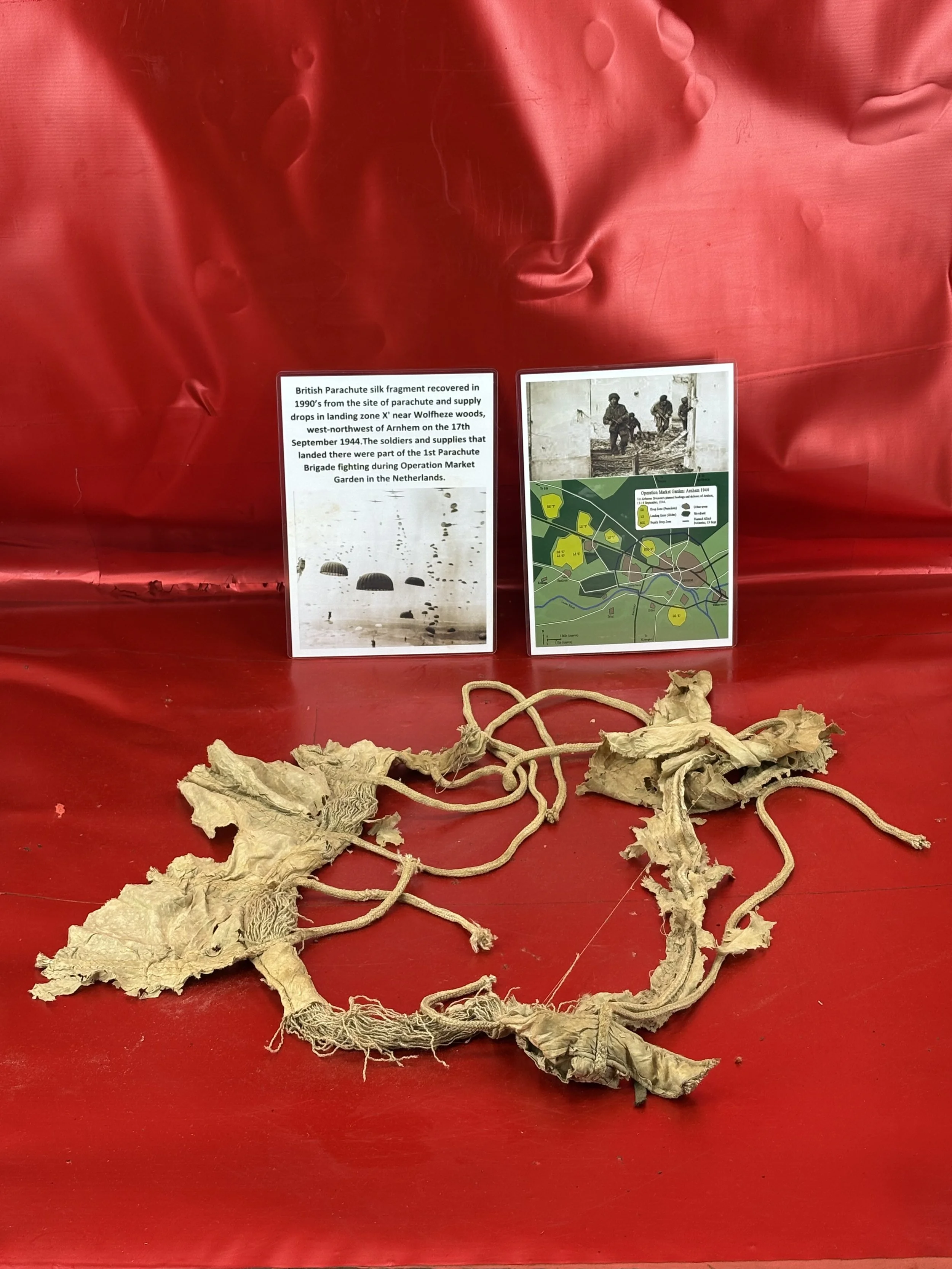 British Parachute silk large fragment with many strings recovered in 1990’s from the site of landing zone X' near Wolfheze woods in Arnhem from the 17th September 1944 drop zone