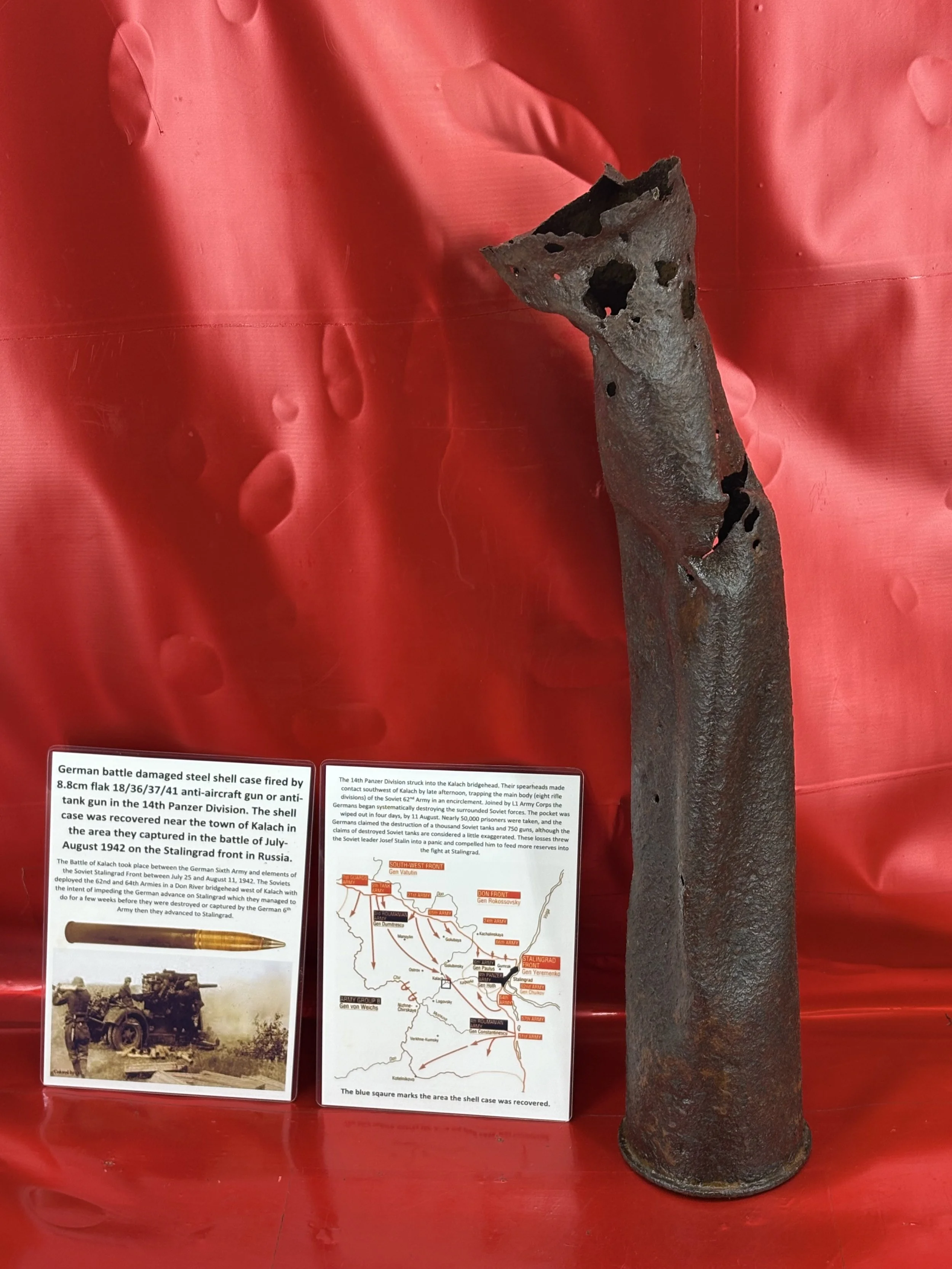 Battle damaged German 88mm gun steel shell case used by Flak 8.8cm gun in the 14th Panzer Division, recovered near the town of Kalach on the Stalingrad front 1942 in Russia.