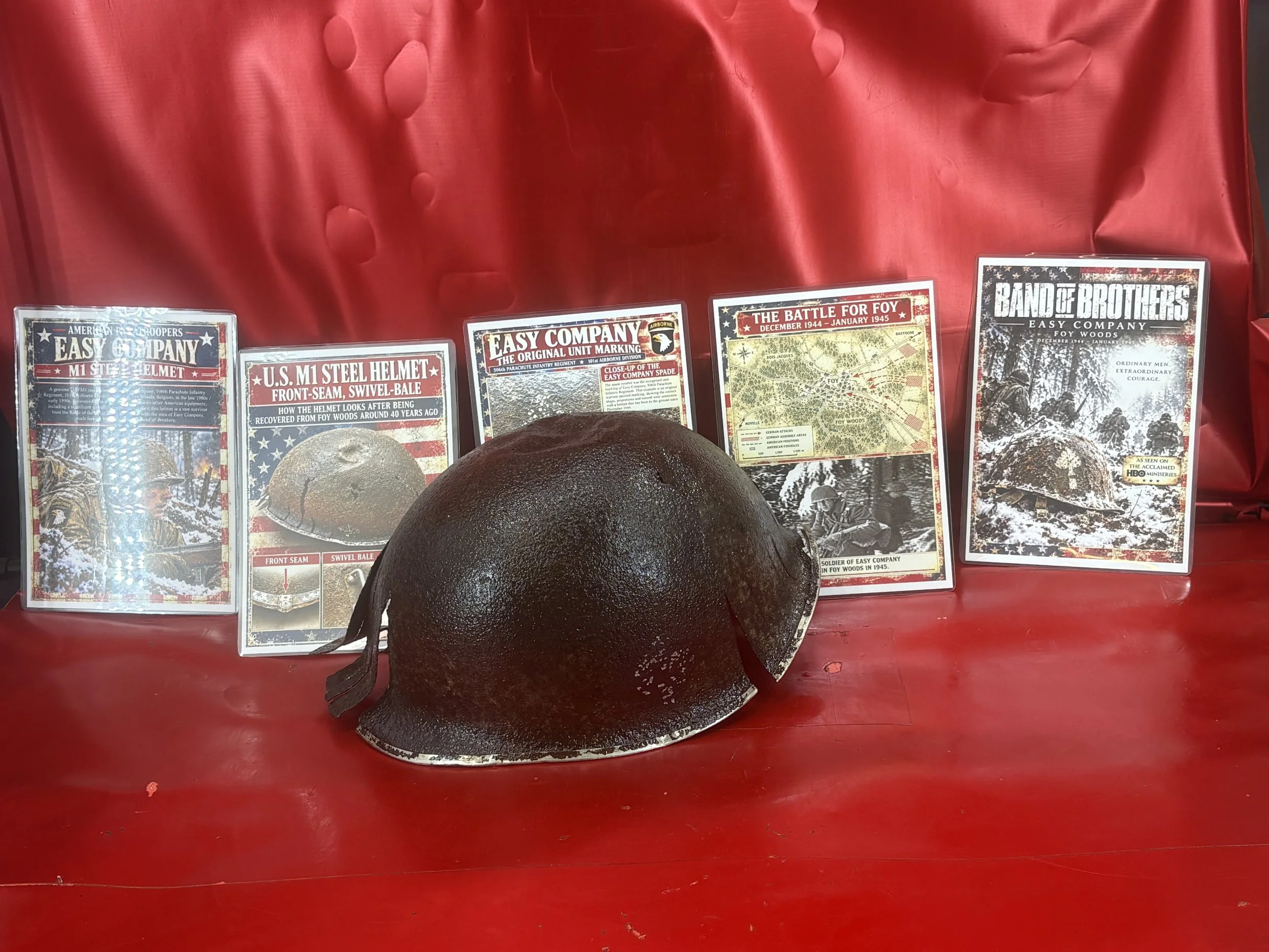 Totally rare complete one off heavily battle-damaged American Easy company M1 steel helmet with its badges, that was recovered in the 1980's from the famous Foy woods, Belgium in battle of Bulge