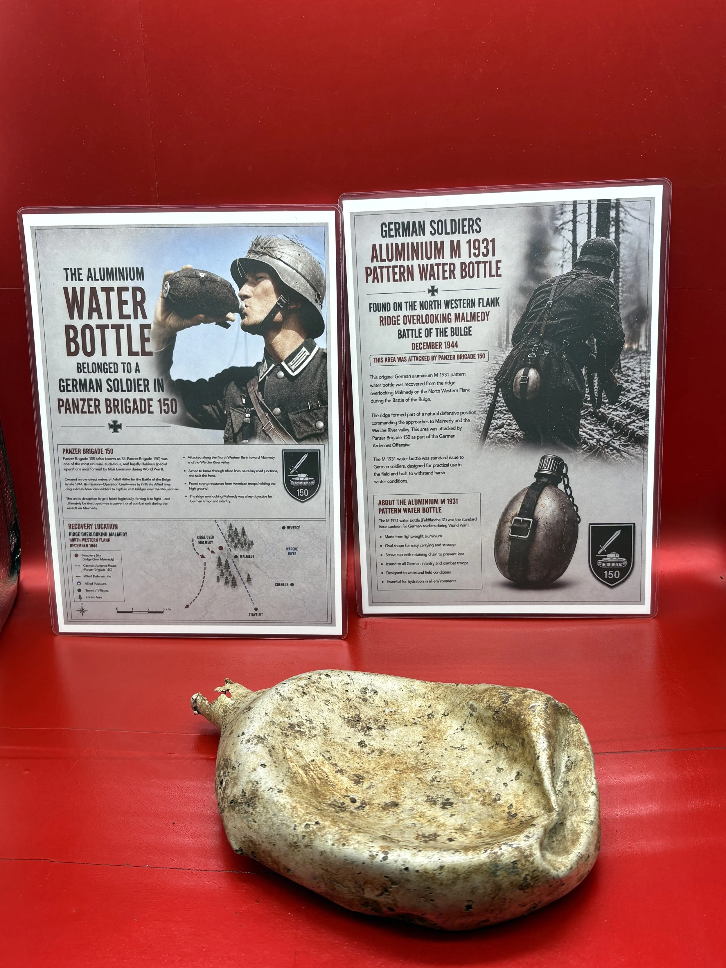 Battle damaged M1931 pattern aluminium water bottle used by German soldier in 150 Panzer Brigade recovered from the ridge overlooking Malmedy, Battlefield of December 1944,The Ardennes forest