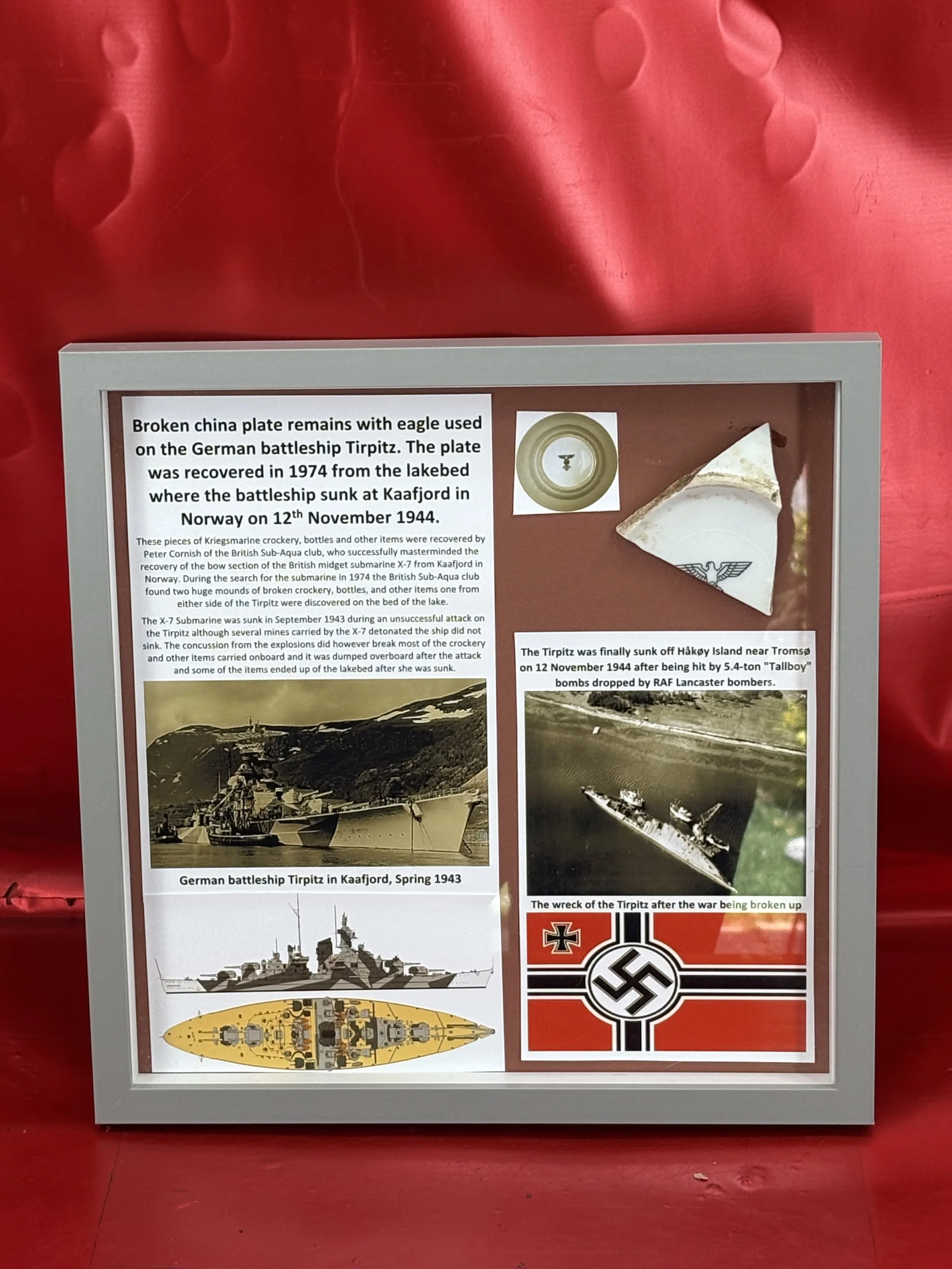 Very rare glass framed broken china plate with eagle used on the German battleship Tirpitz, recovered in 1974 from the battleship sunk at Kaafjord in Norway on 12th November 1944.
