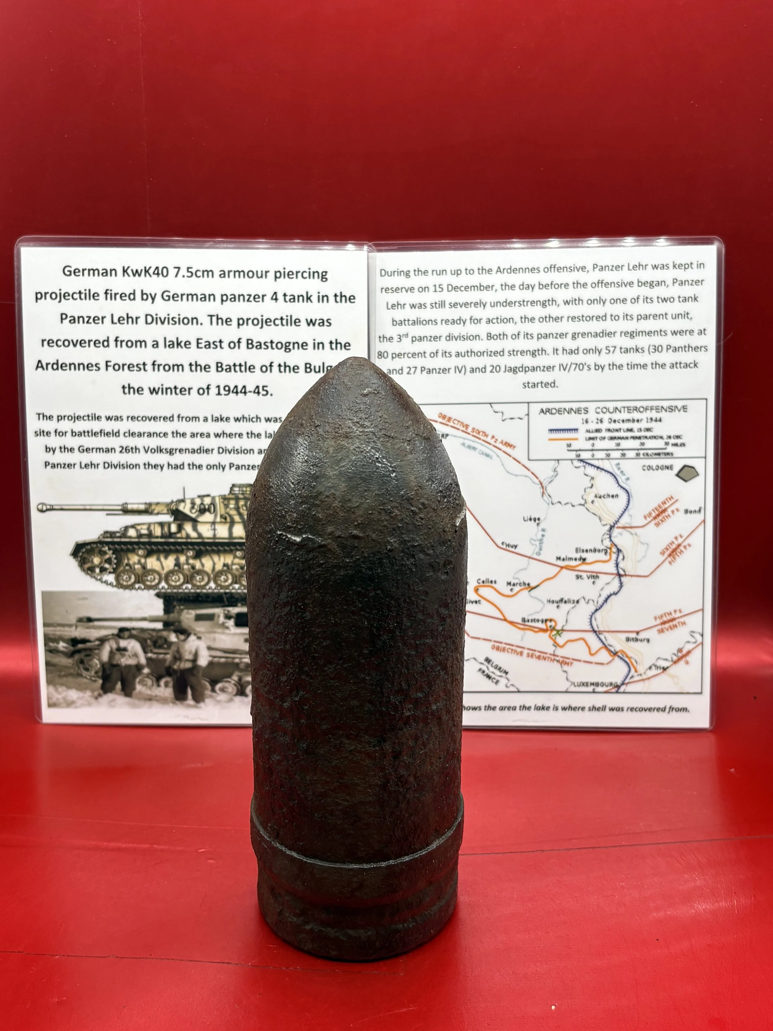 German KwK40 7.5cm armour piercing projectile,complete driving band fired by German panzer 4 tank, it was recovered from a lake which is East of Bastogne in the Ardennes Forest 1944-1945