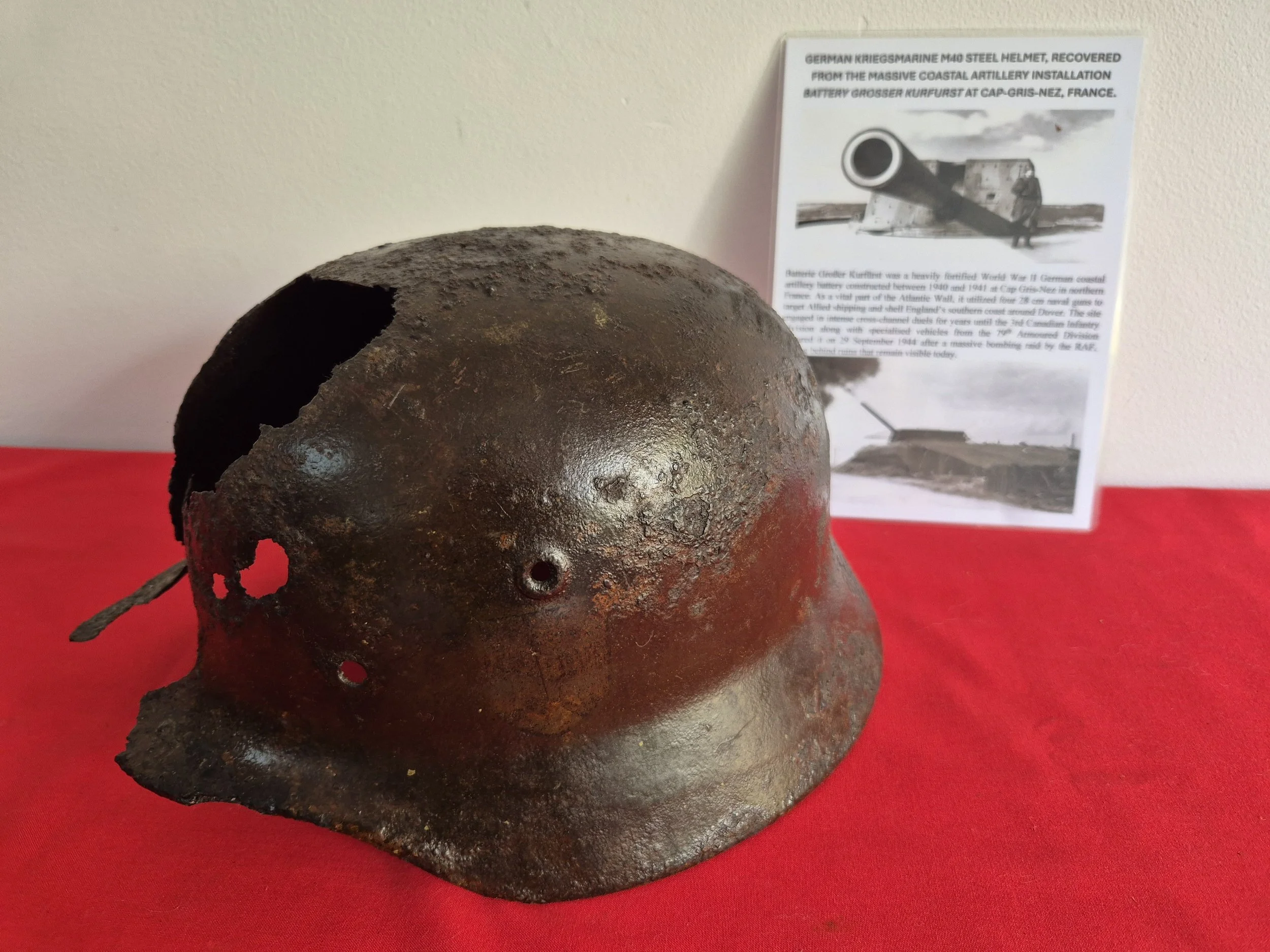 GERMAN KRIEGSMARINE M40 STEEL HELMET, RECOVERED FROM THE MASSIVE COASTAL ARTILLERY INSTALLATION BATTERY GROSSER KURFURST AT CAP-GRIS-NEZ, FRANCE.