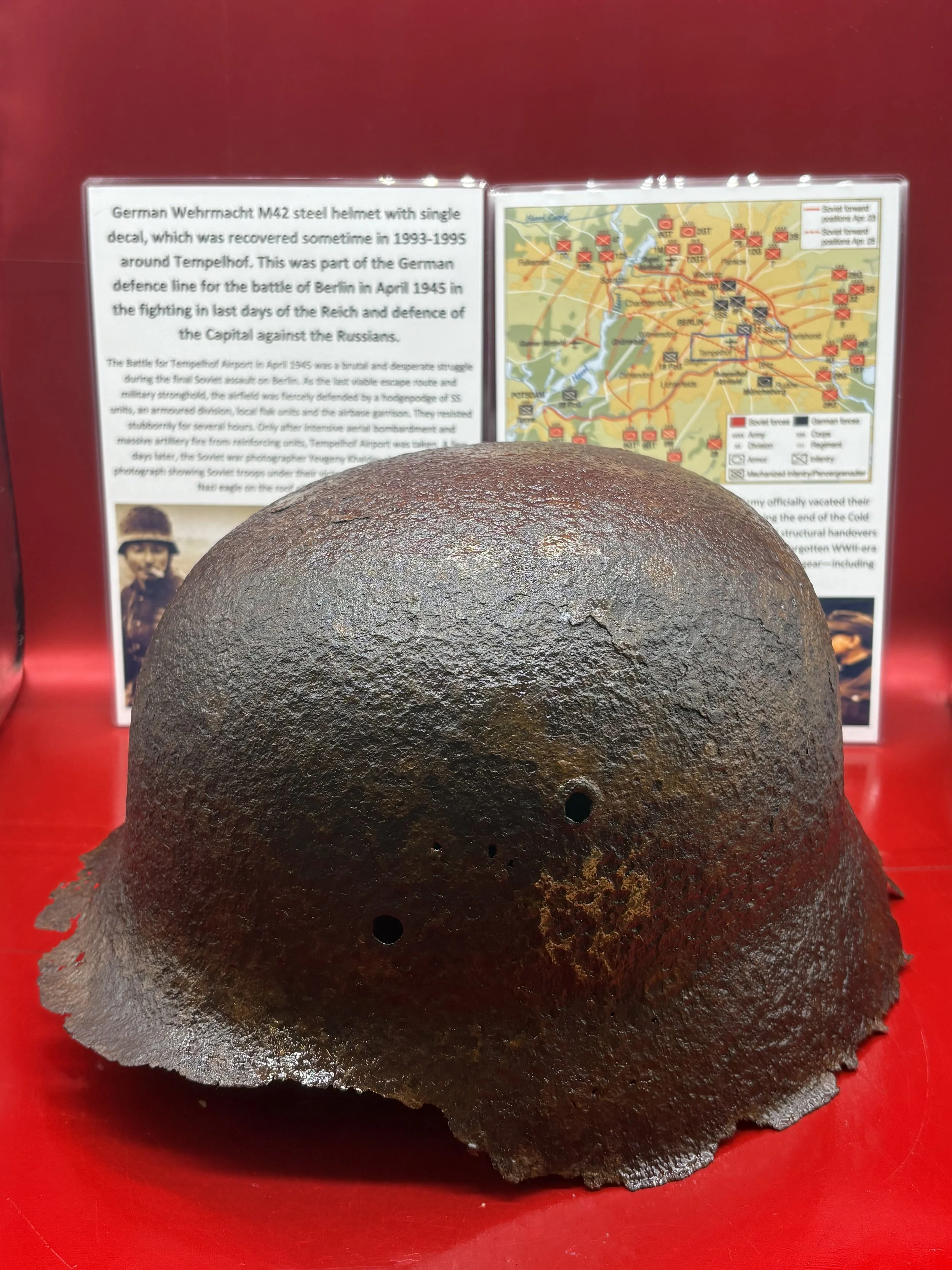 German Wehrmacht M42 steel helmet with single decal,paintwork remains recovered in 1993-1995 around Tempelhof airport from the Battle of Berlin,April 1945