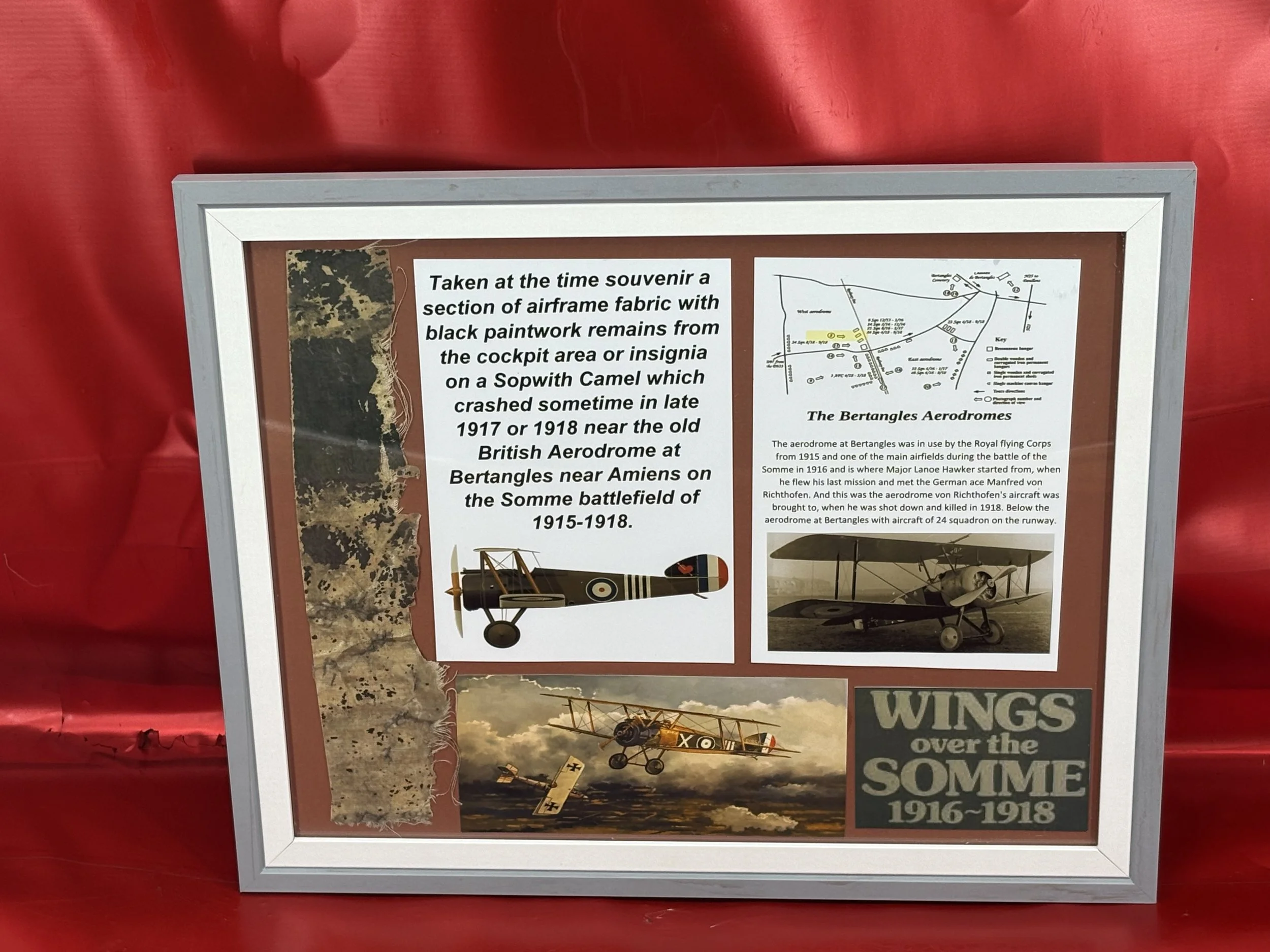 Glass framed Totally rare taken at the time souvenir a section of airframe fabric with lots of black paintwork remains from the cockpit area or insignia on a Sopwith Camel,crashed-Somme battlefield