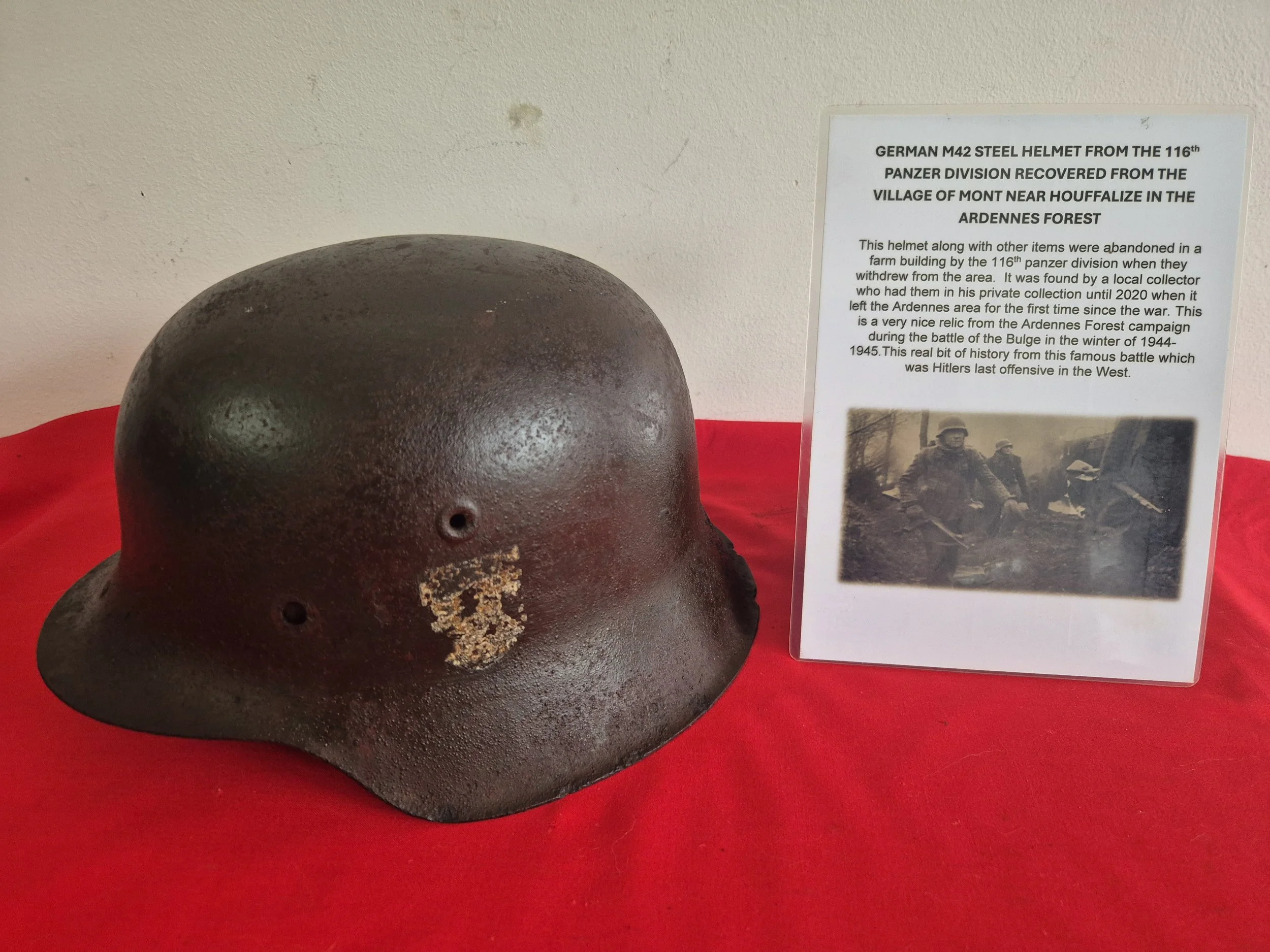 German M42 steel helmet from the 116th panzer division recovered from the village of Mont near Houffalize in the Ardennes forest.