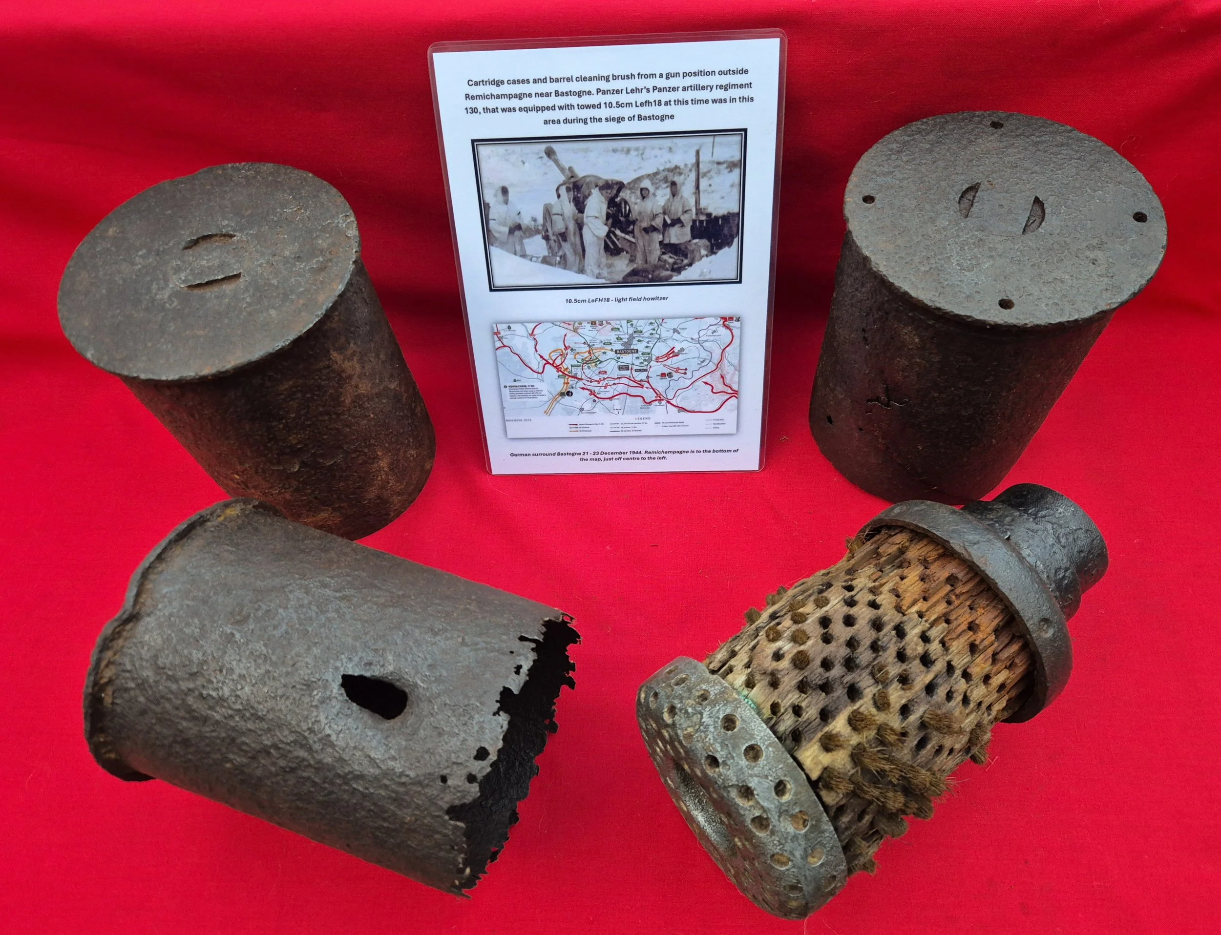 German 10.5cm Lfh18 howitzer shell cases & barrel cleaning brush from Panzer Lehr's 130 artillery regiment recovered near Bastogne Ardennes