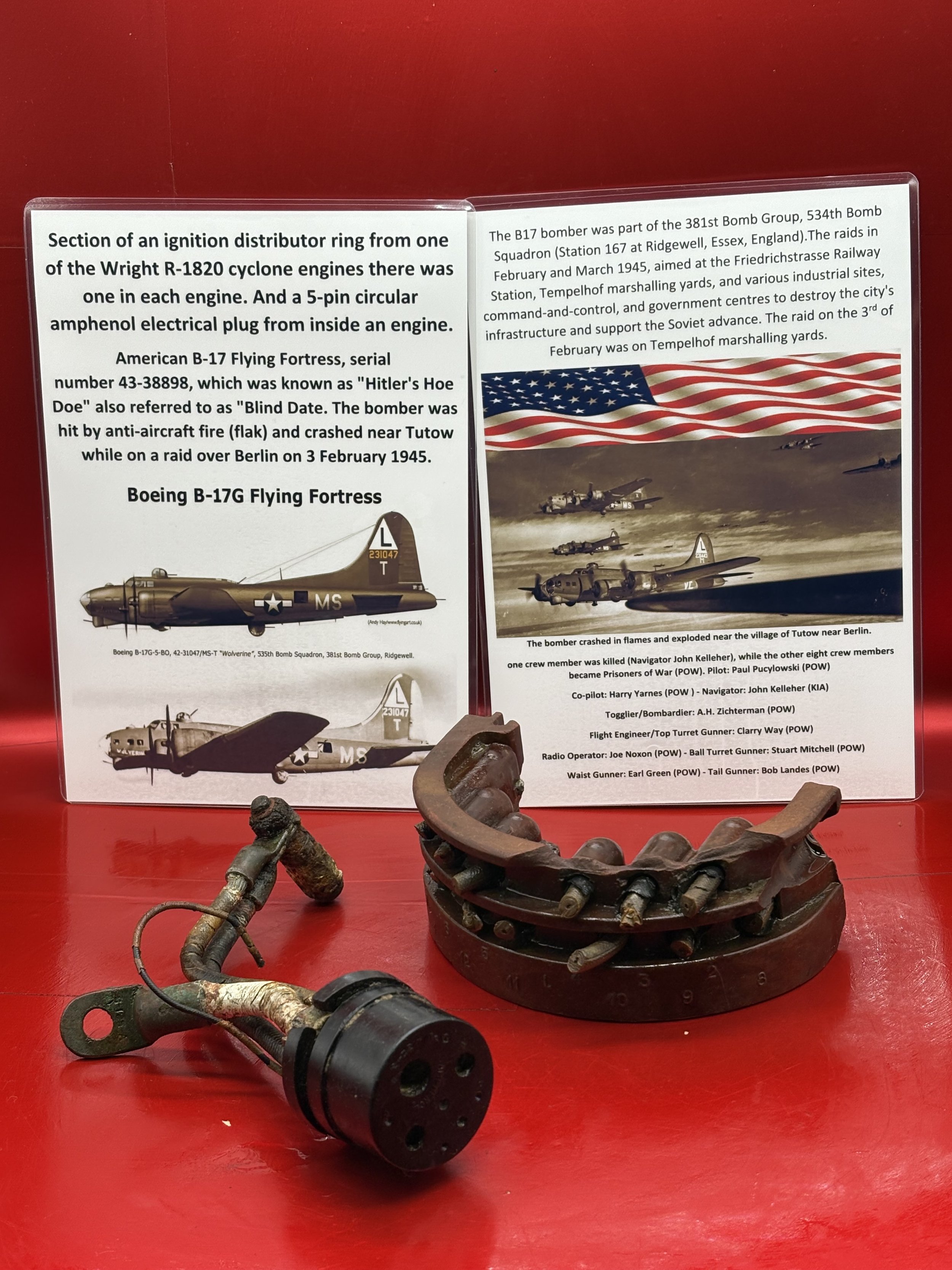 Section of an ignition distributor ring, 5-pin circular amphenol electrical plug from engine on American B-17 bomber number 43-38898 named Hitler's Hoe do, crashed Tutow near Berlin 3 February 1945