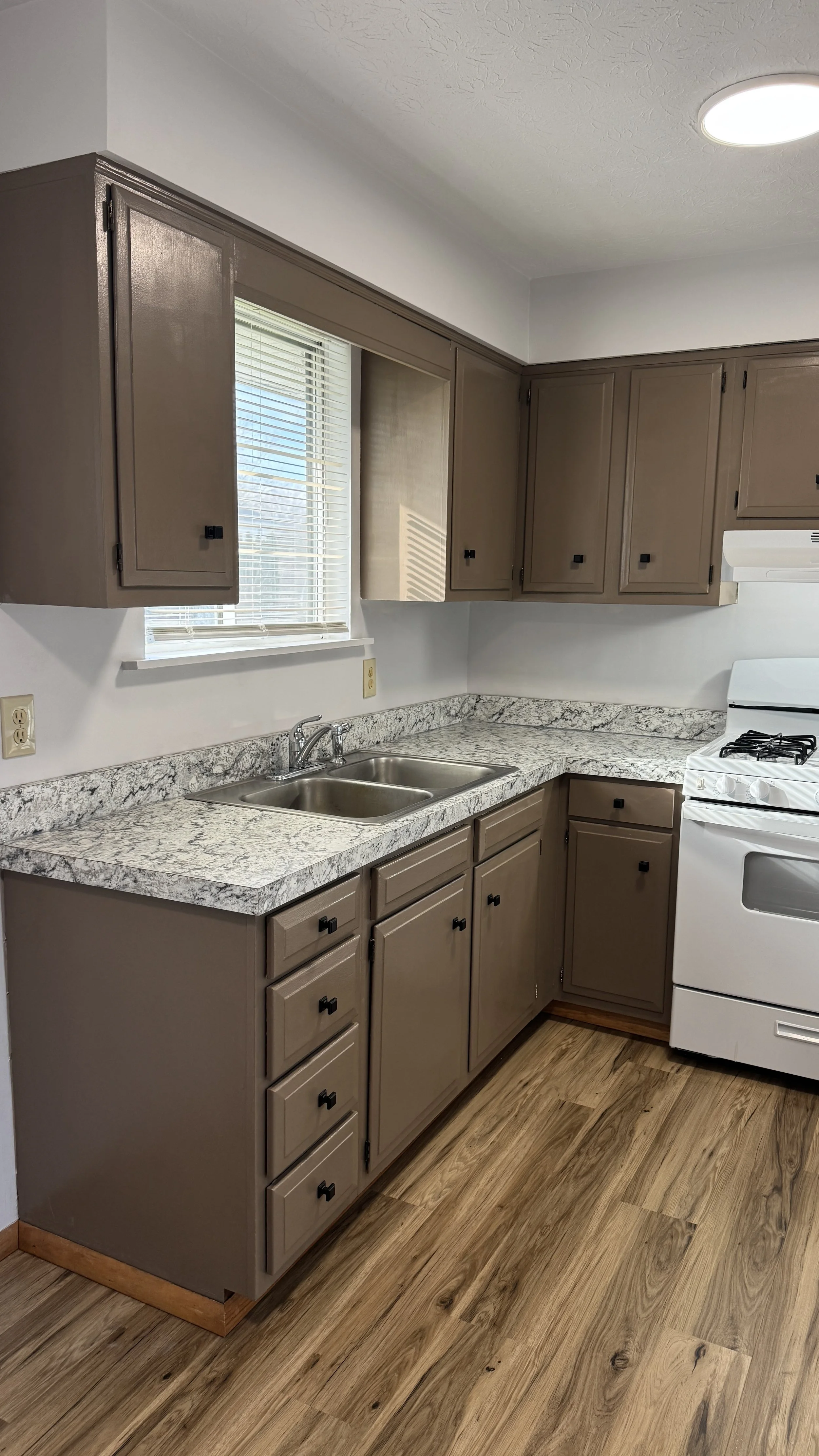 After photo - renovated kitchen with new countertops and refinished cabinets in Canton OH