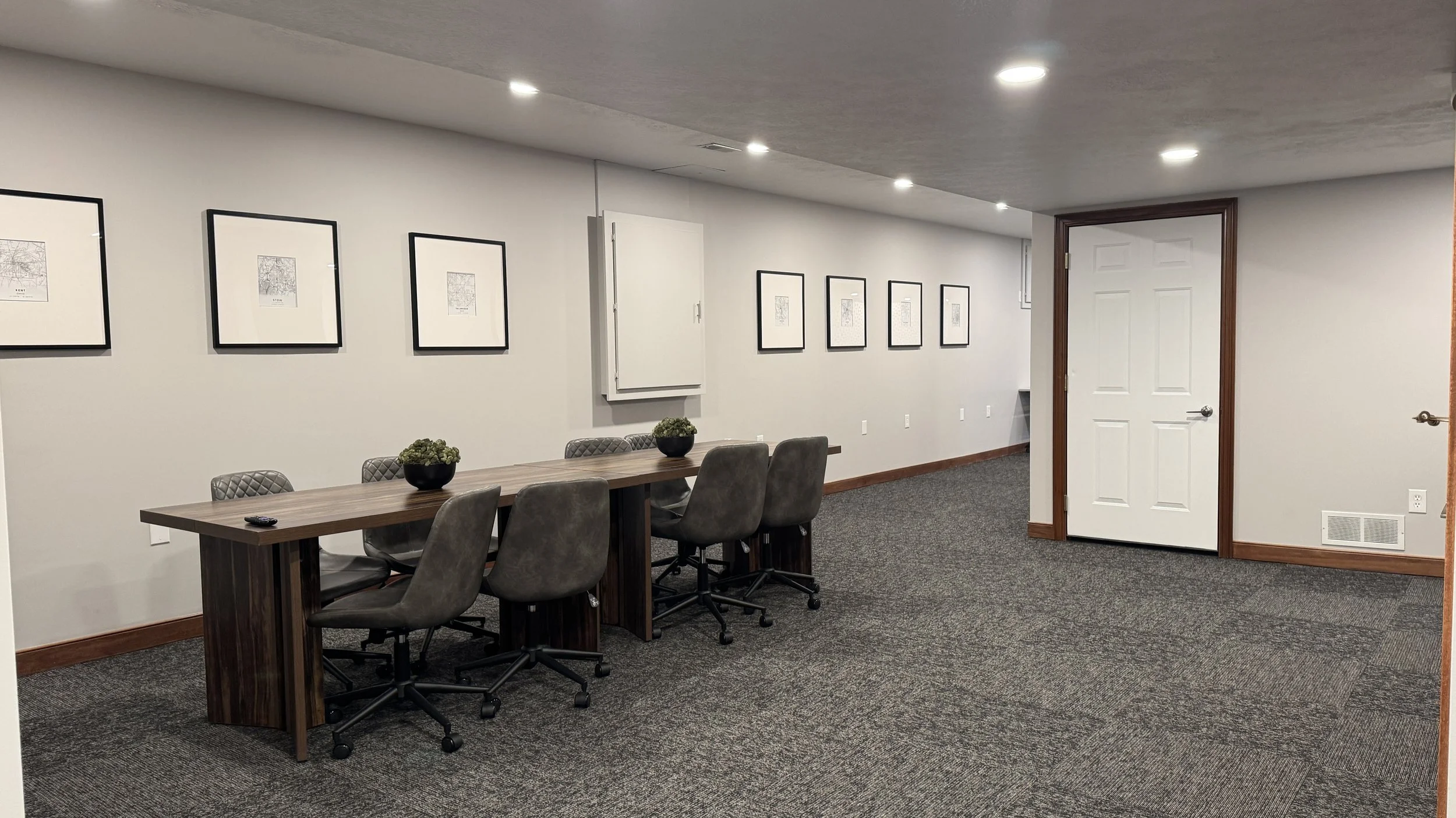 After Photo - Conference area with new paint, lights, furniture, carpet