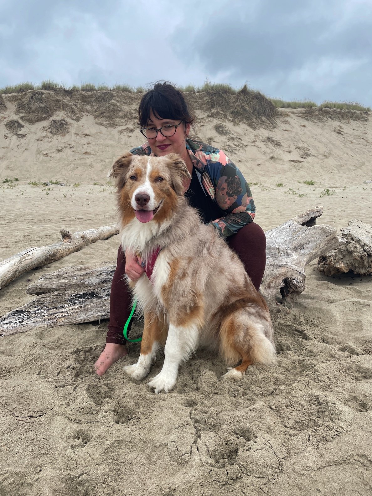 Sarah and her dog Malley at the beach.