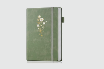 Green notebook with a floral design on the cover