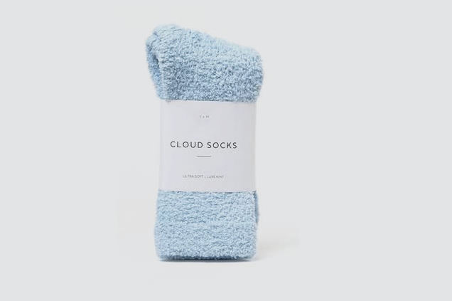 Light blue pair of Cloud Socks, ultra soft, on a white background