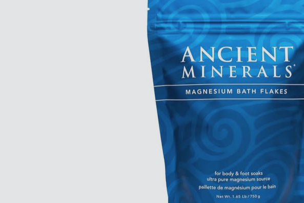 Bag of Ancient Minerals Magnesium Bath Flakes with blue packaging.