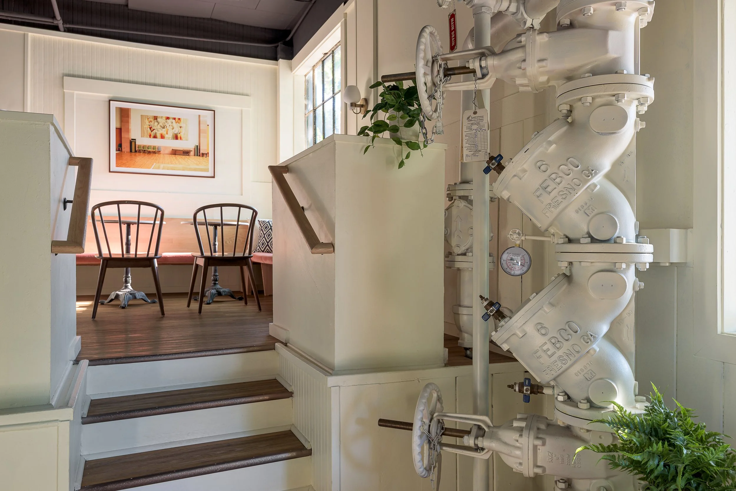 Domek restaurant embraced design elements of the historic building, like this fire sprinkler stack