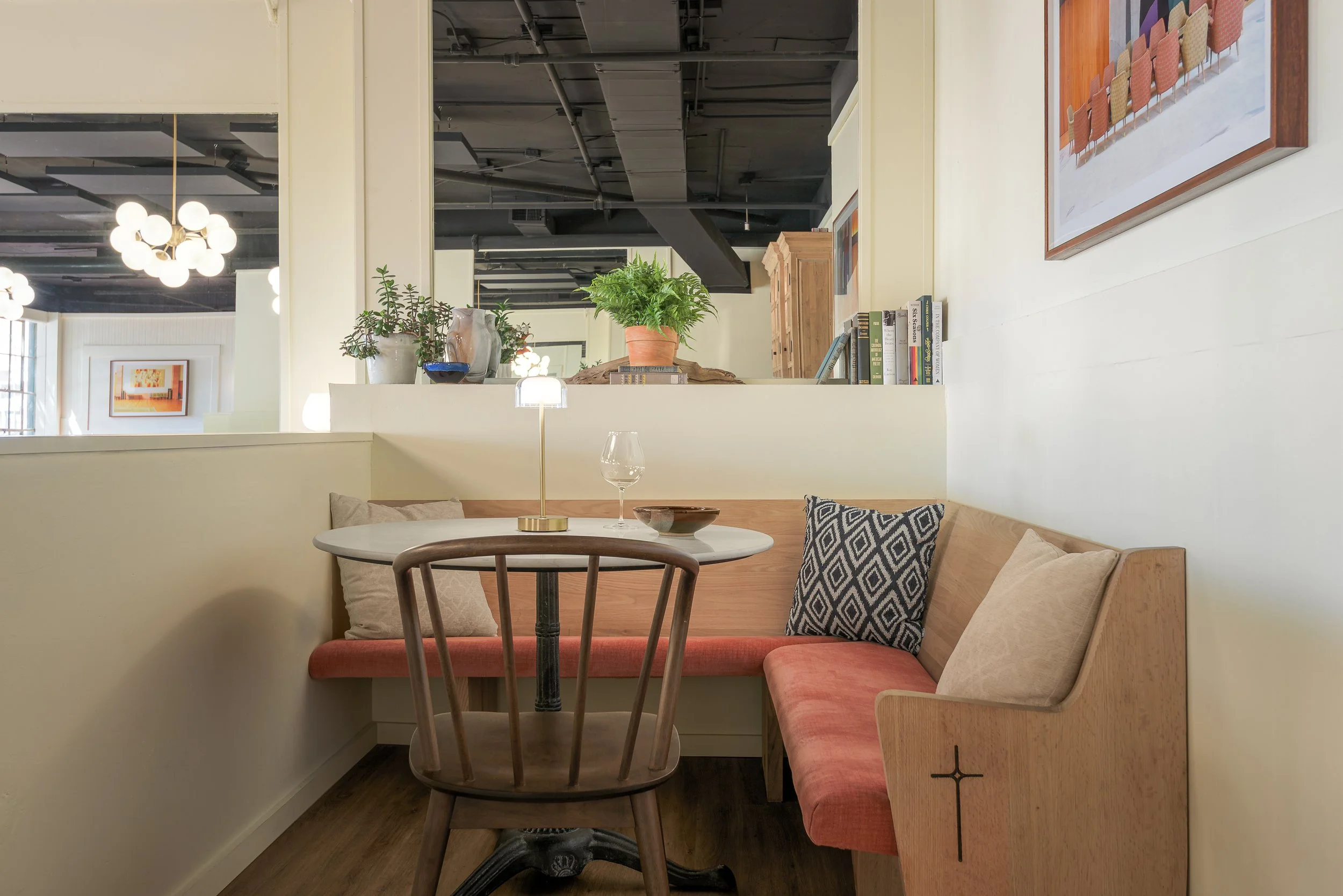 Bench seating and low walls create a cozy corner for intimate dining for small groups