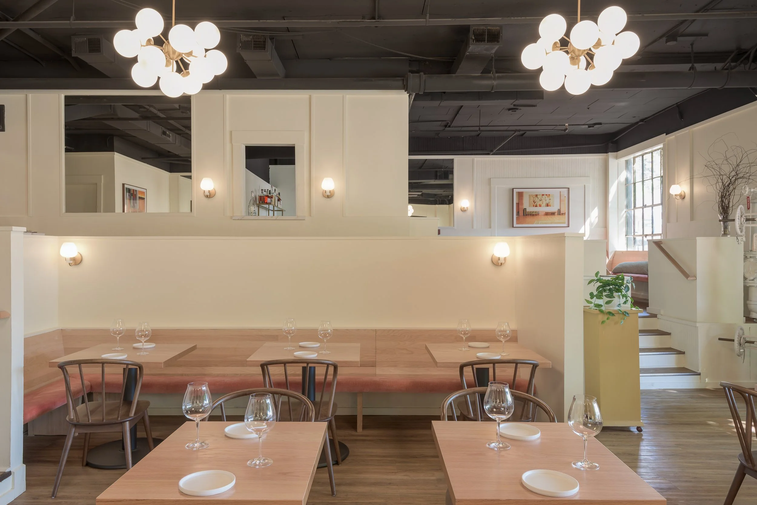 In Domek restaurant, half walls define the main dinging room from the bar and service areas