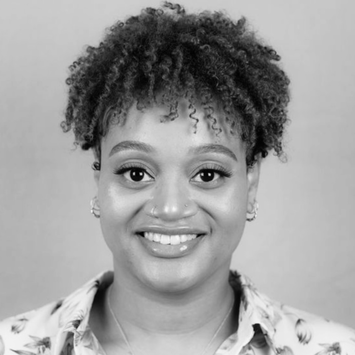 Professional headshot of JaVae Parham, LPC—expert in CBT, DBT, life‑transition support, and therapeutic work with BIPOC women and teens, using cinema and music therapy approaches.