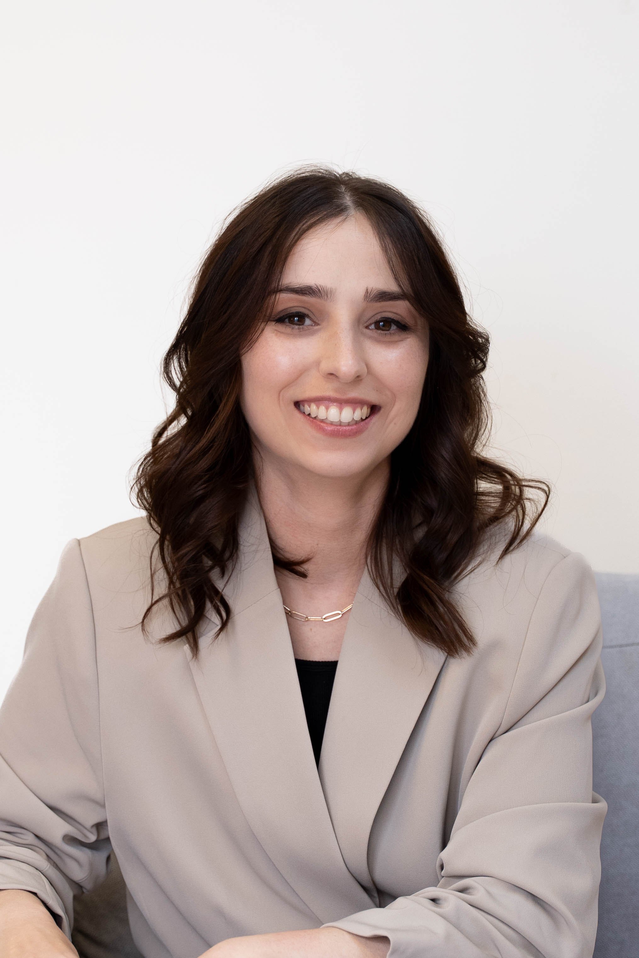 Registered Play Therapist and neuroaffirmative clinician Ahna Ravan, LPC, in her counseling office supporting children and families with evidence‑based, affirming therapy.