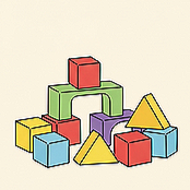 Colorful geometric building blocks including cubes, rectangular prisms, and triangular prisms arranged together.
