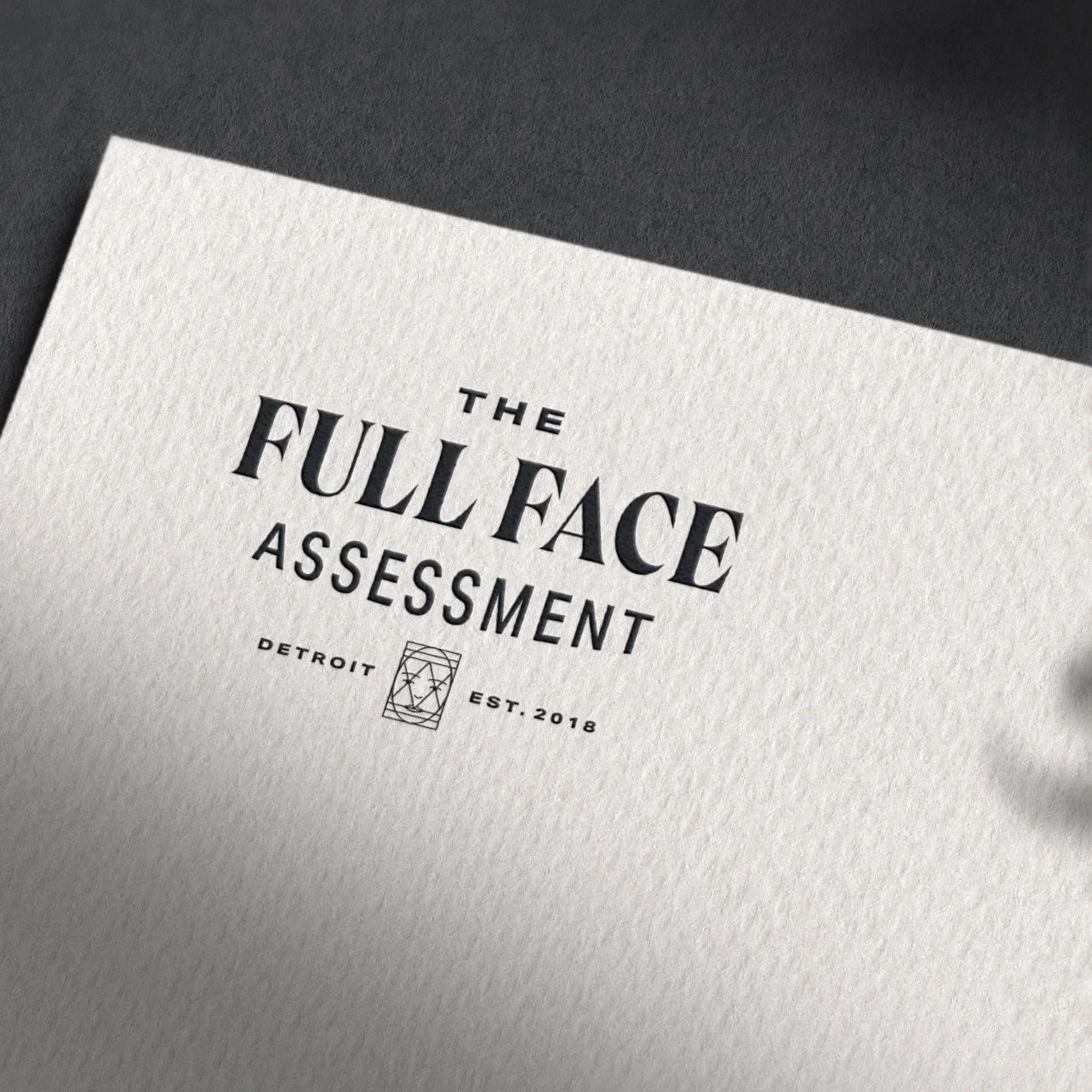 "The Full Face Assessment" lockup printed on cardstock