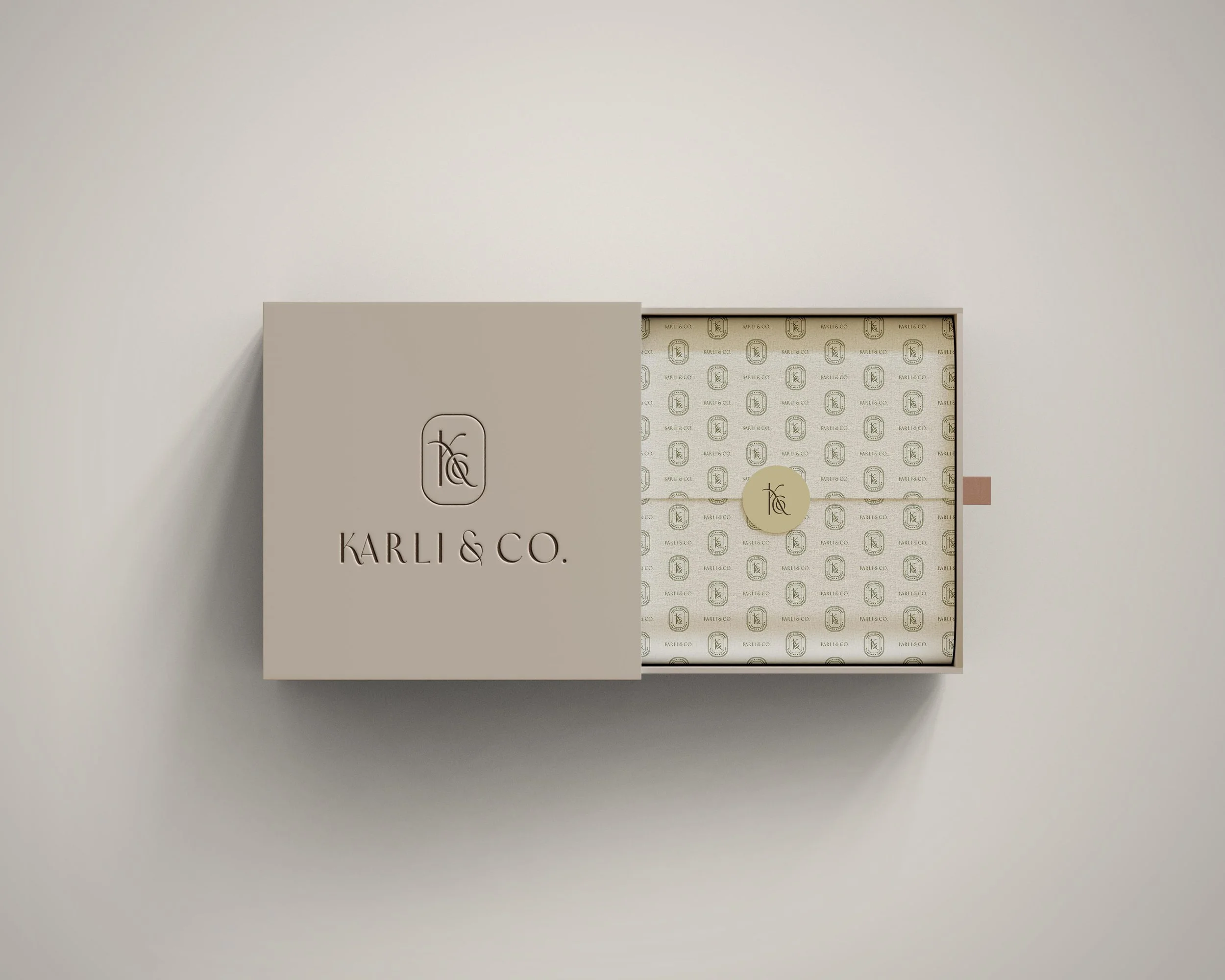 branded gift wrapping for Karli & Co., including a custom box, tissue paper, and sticker