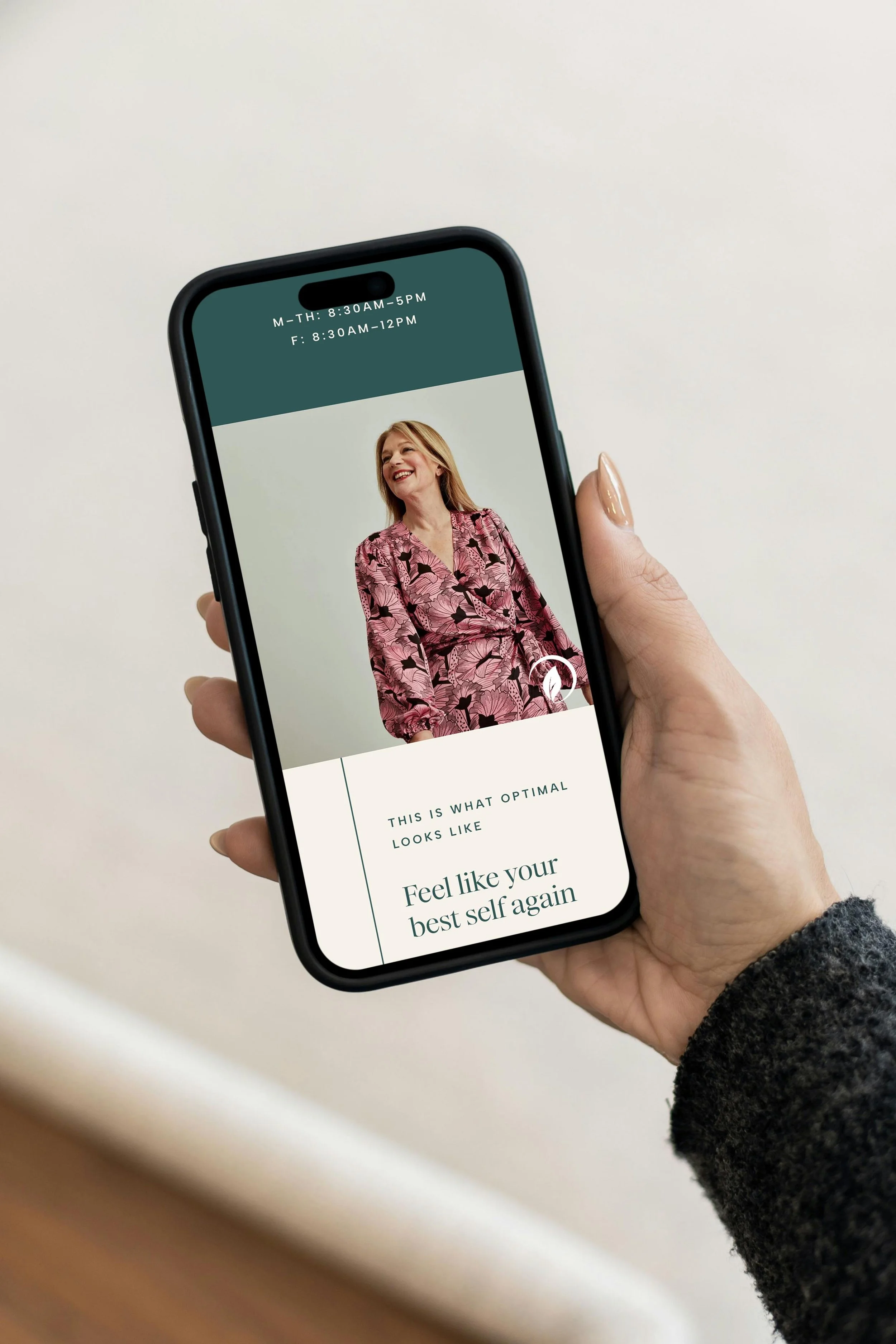 iPhone displaying Her Nova Wellness' website homepage