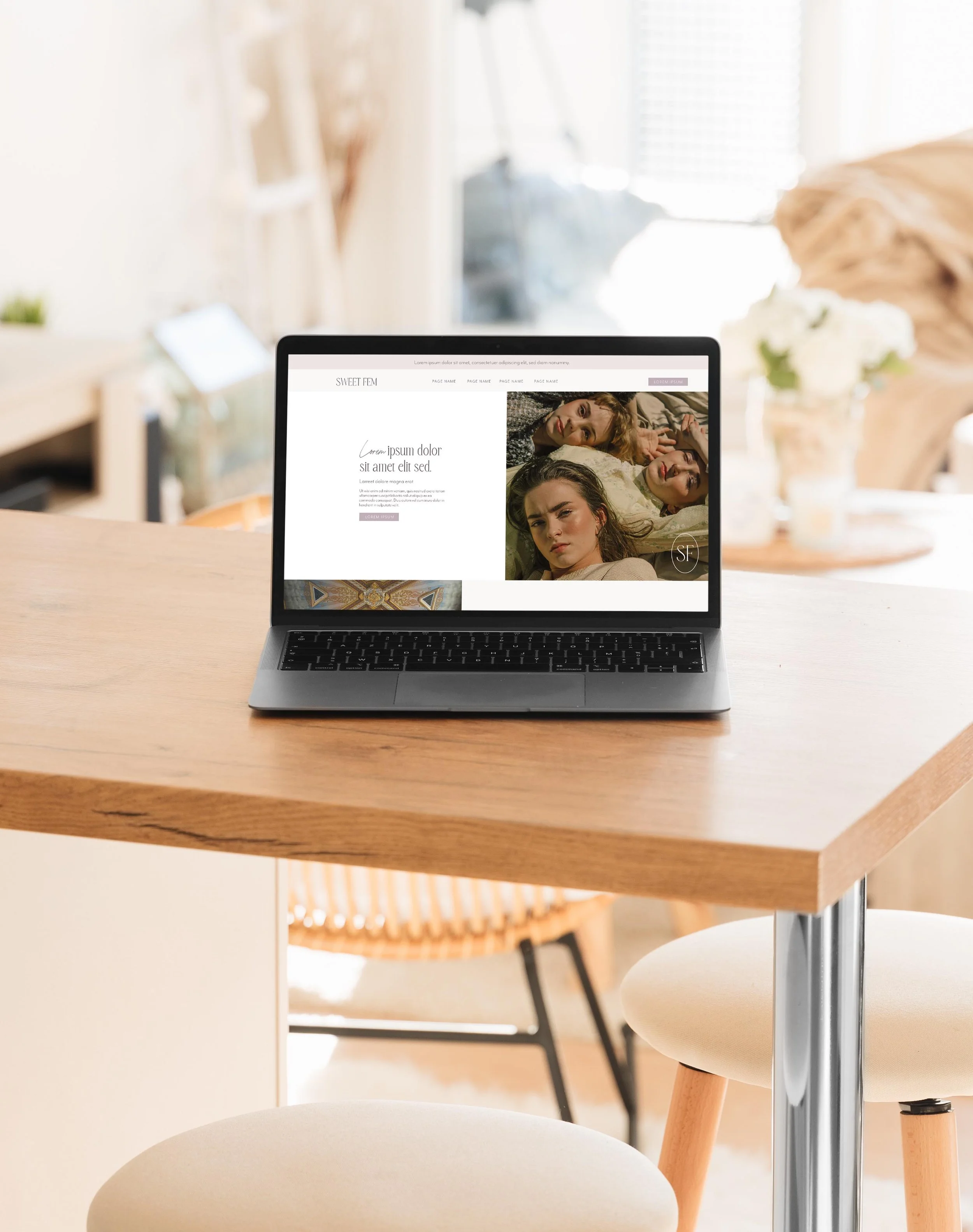 mockup of a romantic squarespace template design on a laptop