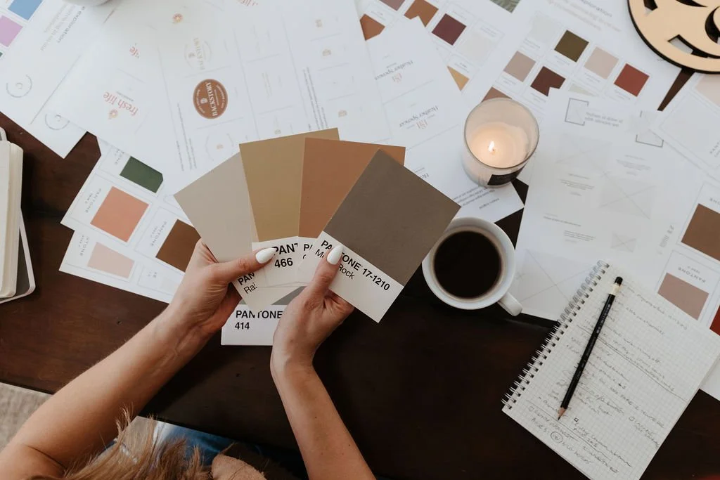 brand designer holding Pantone swatches