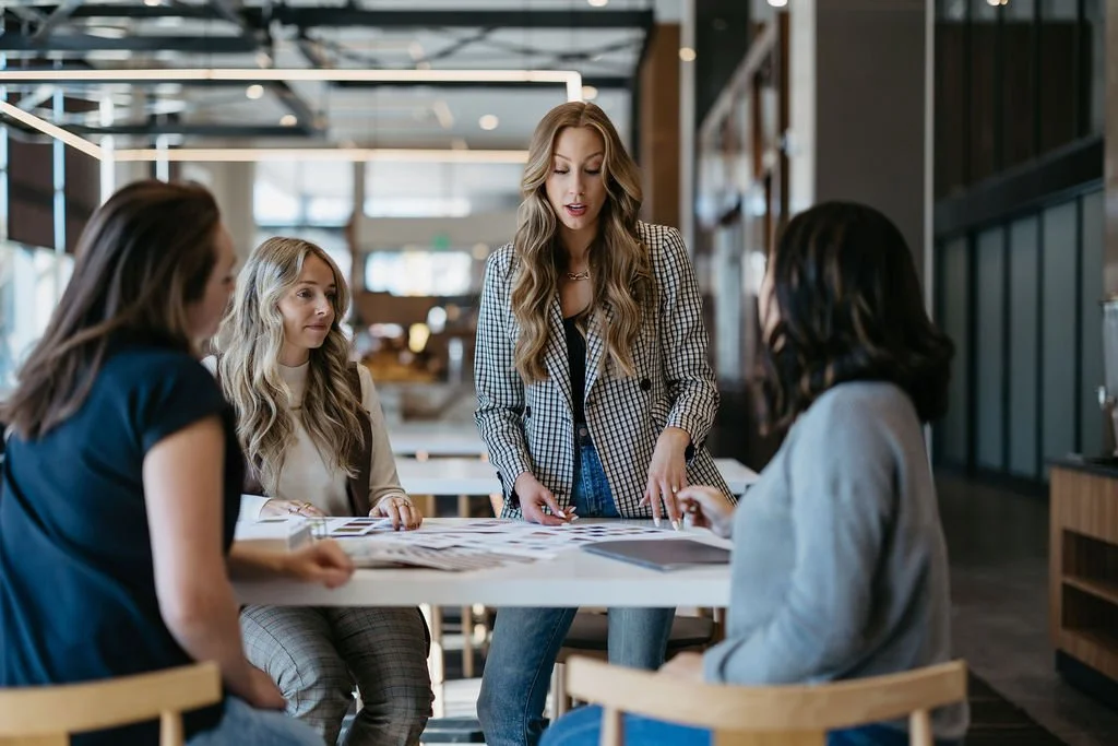 Creme Brands team gathered around a table