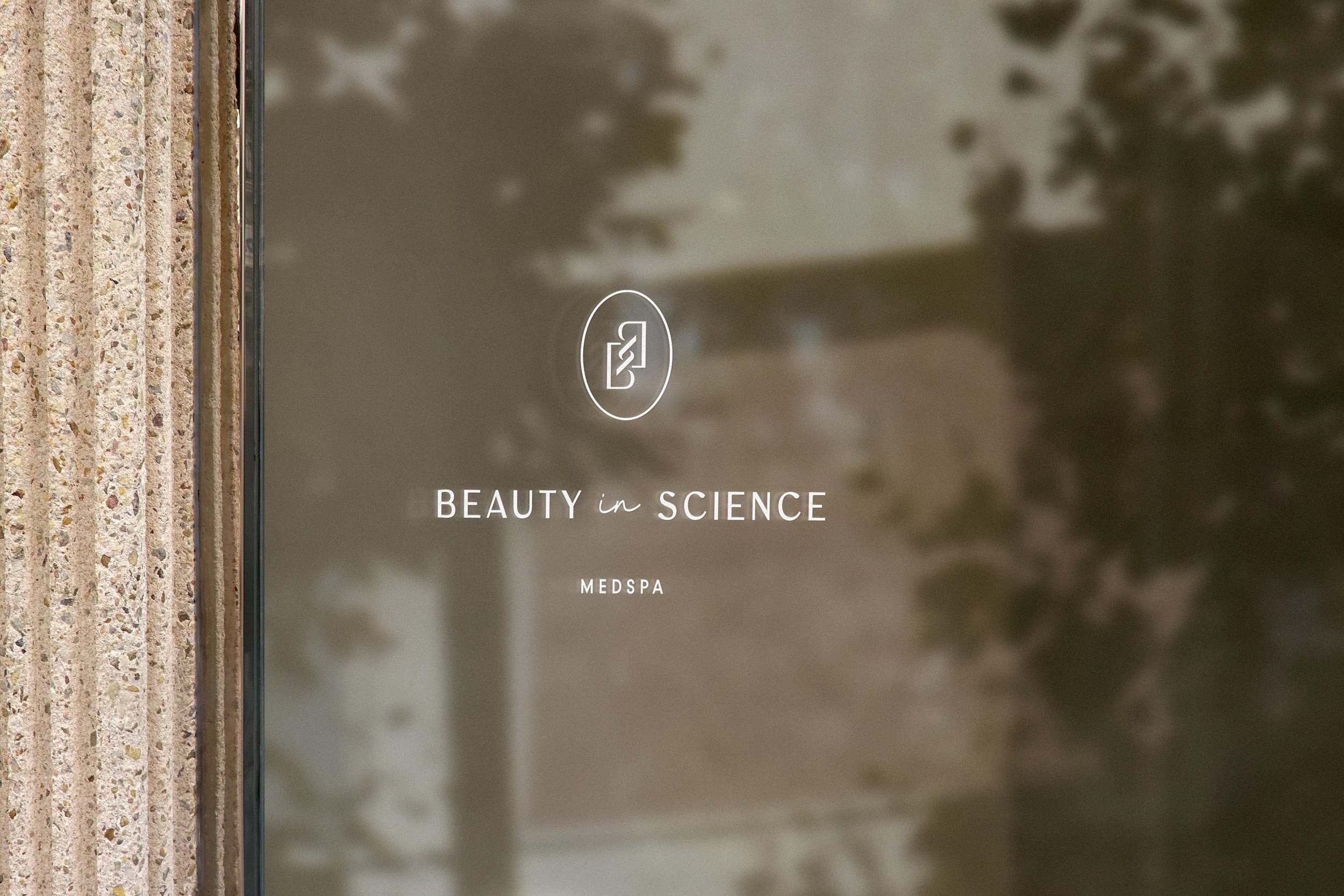Beauty in Science Medspa sign on outdoor window