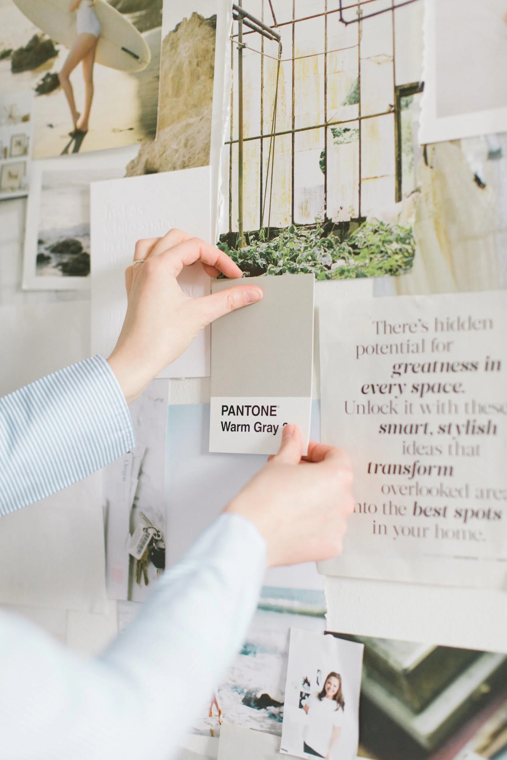 brand designer pinning a Pantone swatch to a moodboard