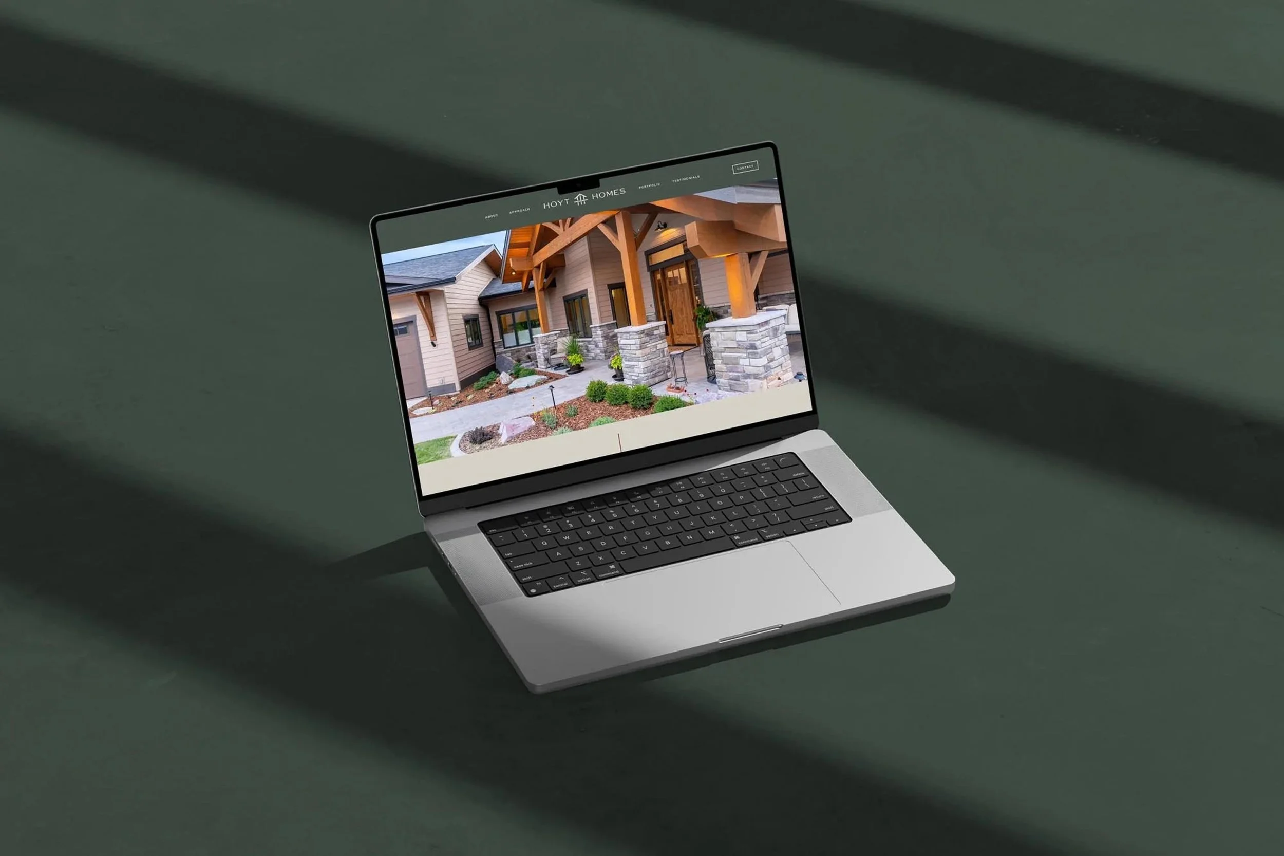 laptop displaying the Hoyt Homes website homepage