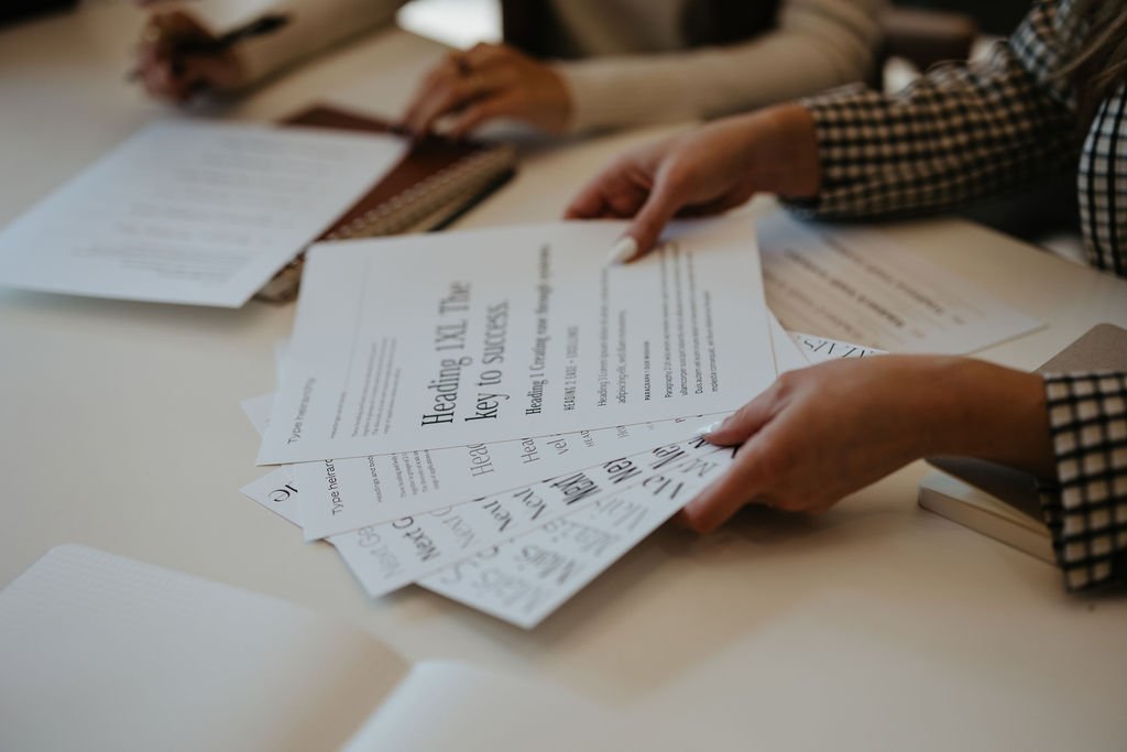 brand designer holding typography samples
