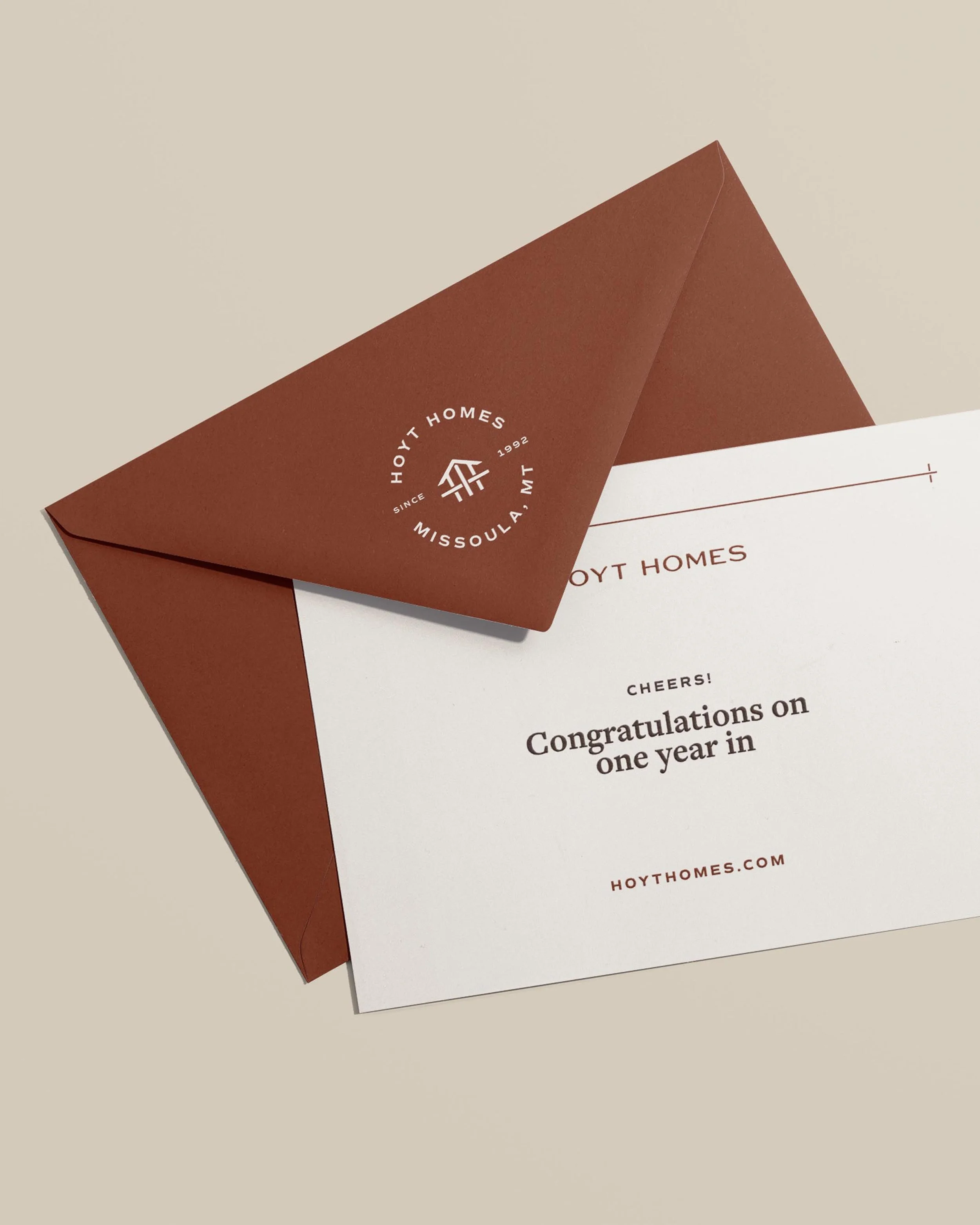 Hoyt Homes branded envelope and notecard congratulating homeowners on one year in