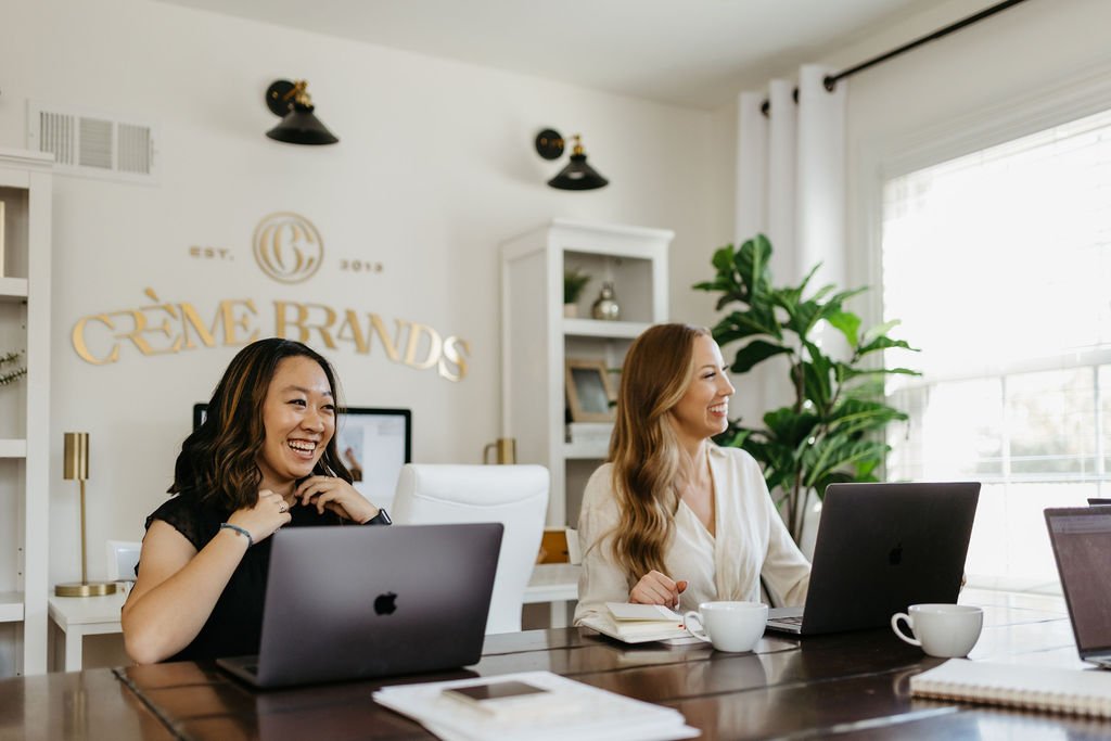 brand designers working on laptops
