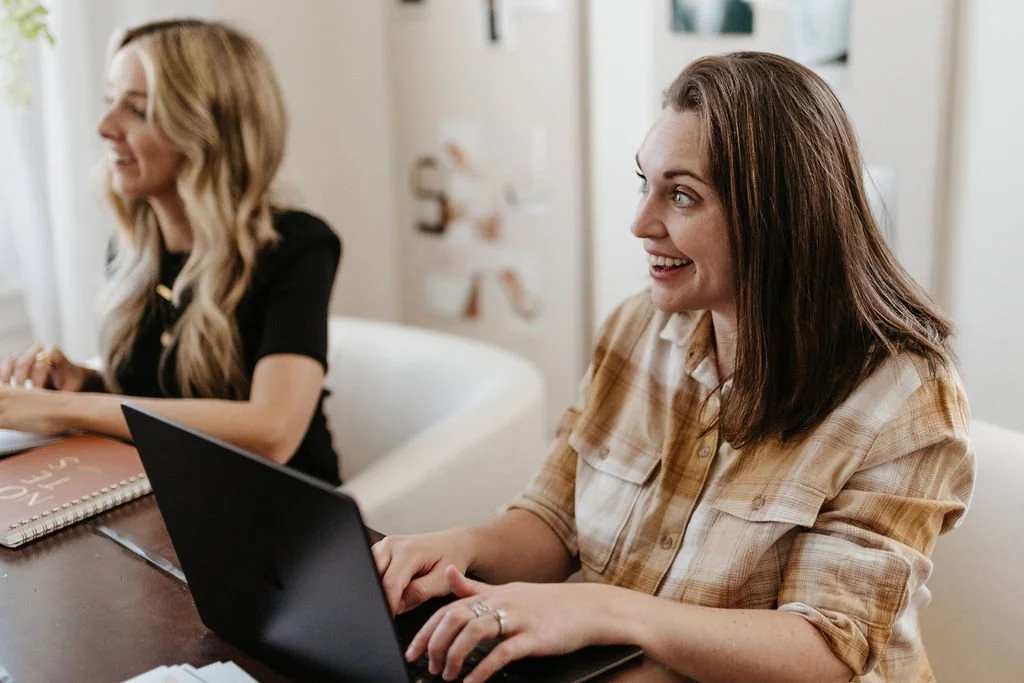 brand designers working on laptops