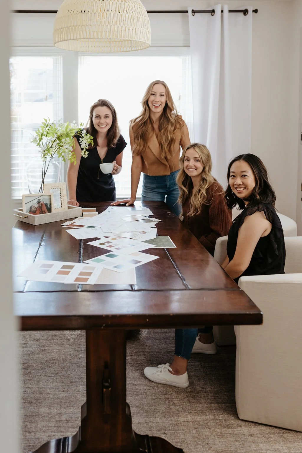 Creme Brands team smiling at studio table