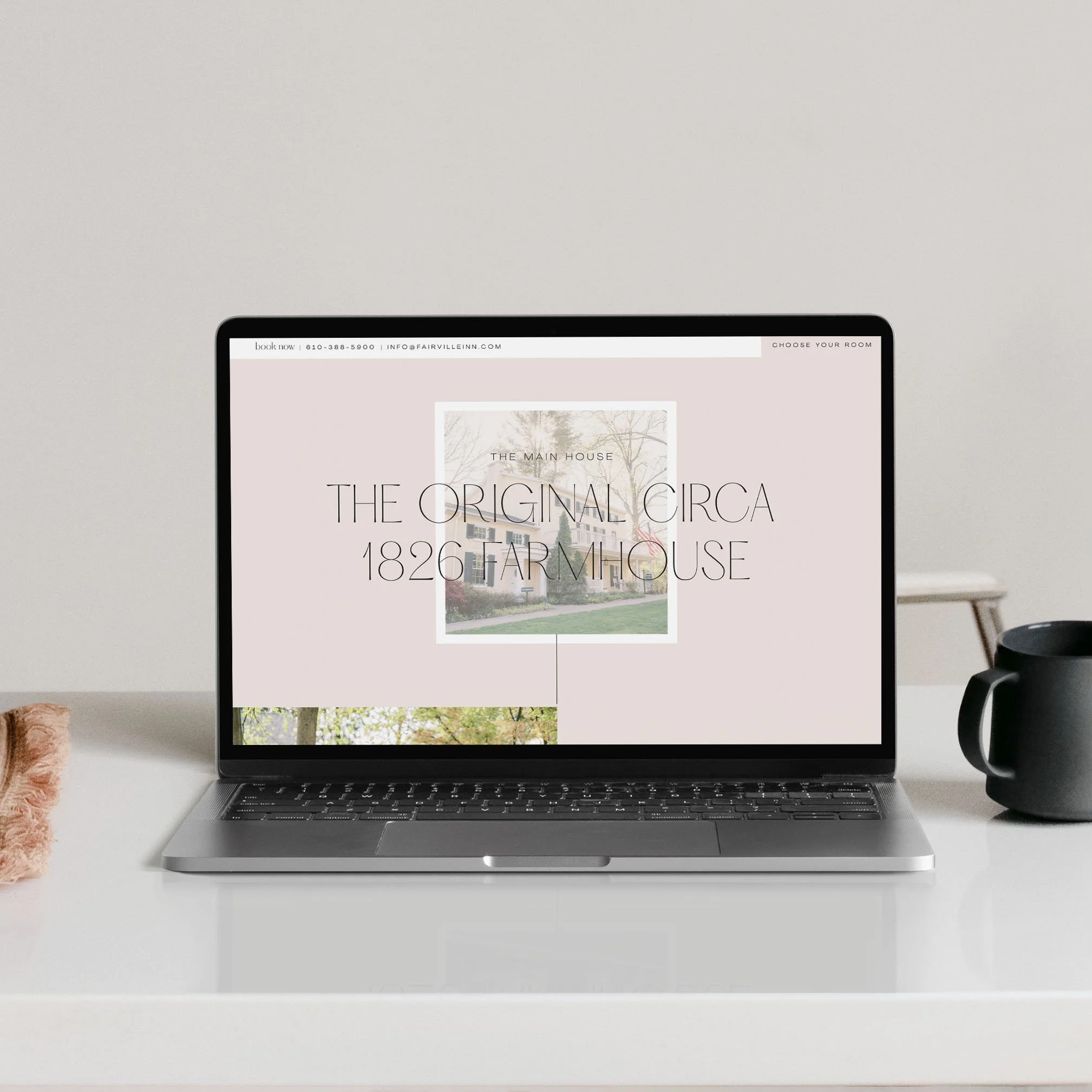 laptop showing the Fairville Inn website homepage