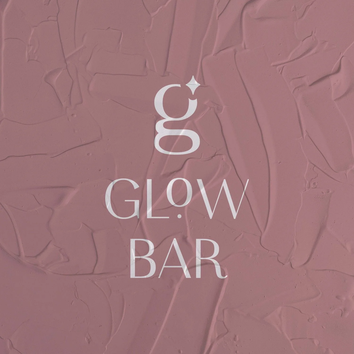 Glow Bar logo on textured pink wall