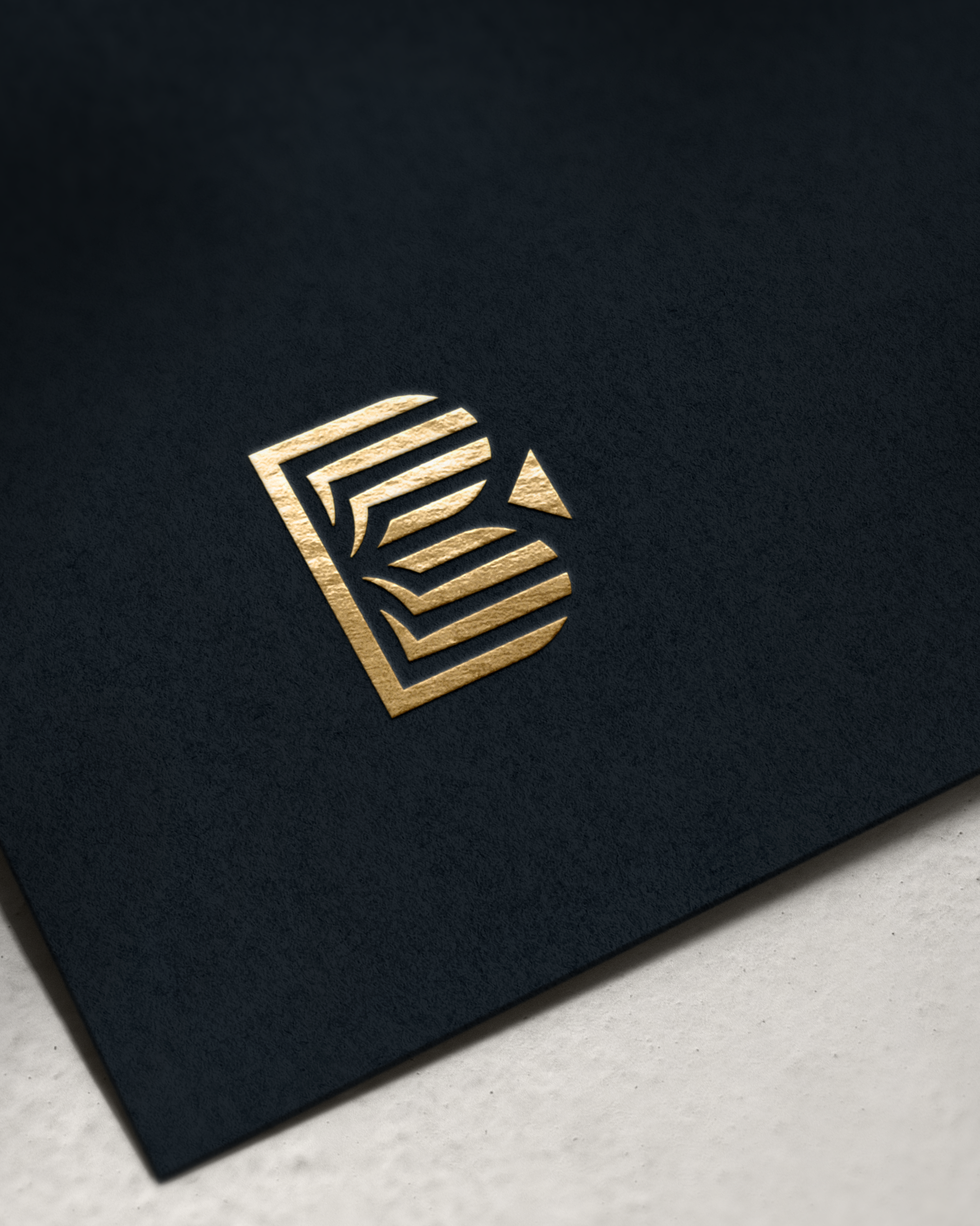 B icon gold foil printed on black cardstock