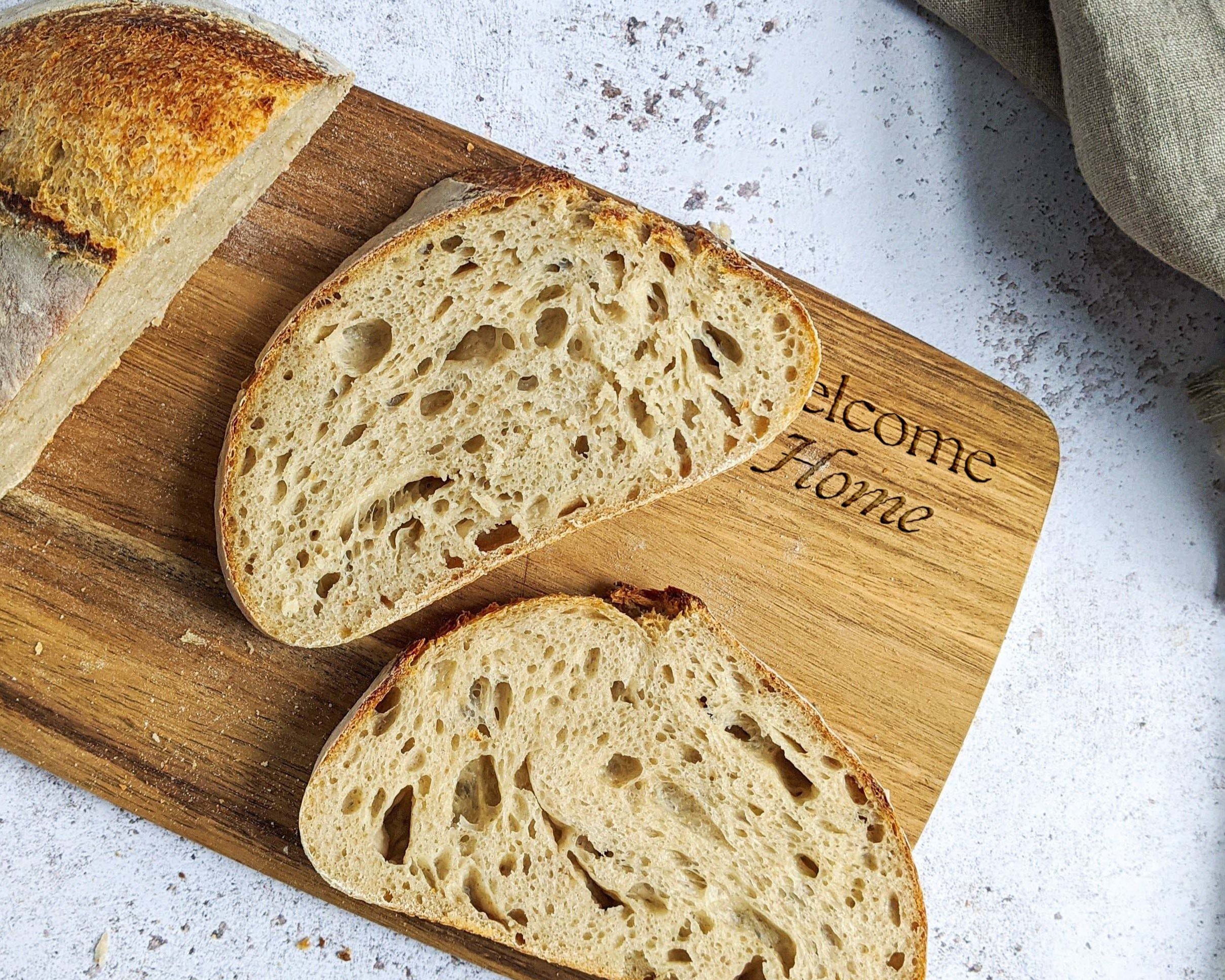 "Welcome home" tagline engraved on cutting board