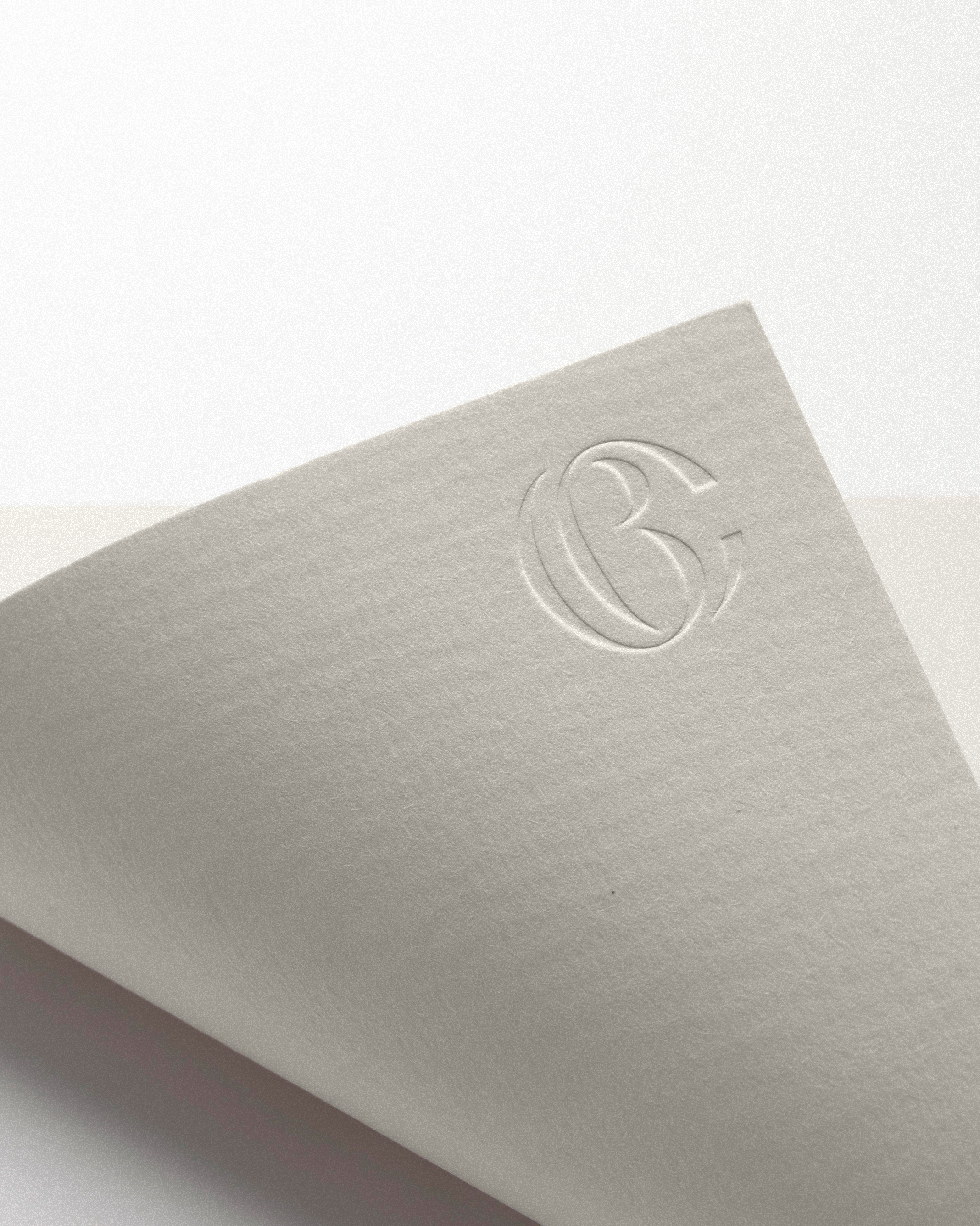 Creme Brands logo embossed on cardstock