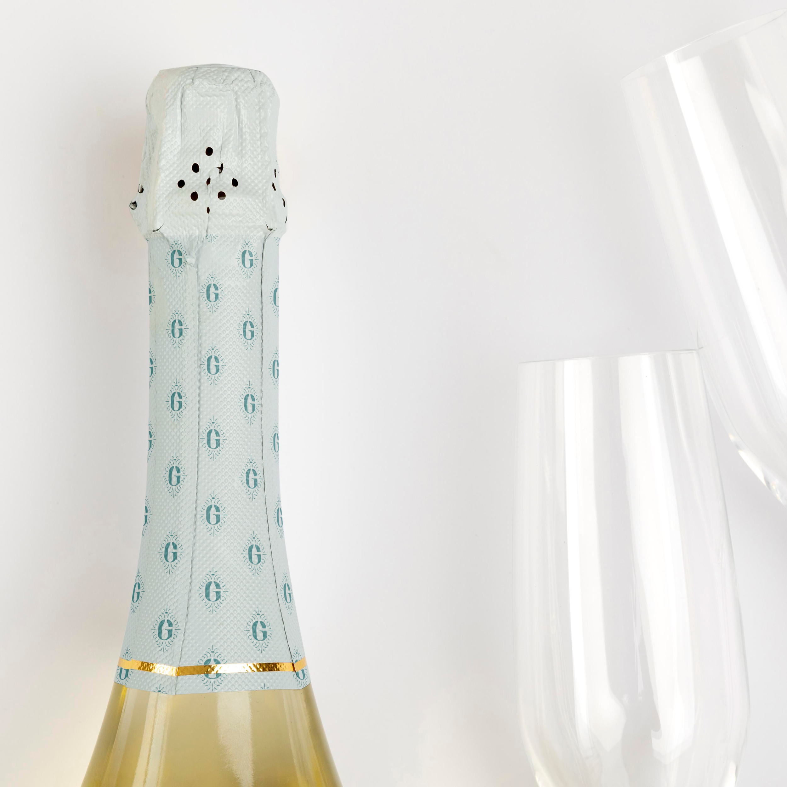 Glint Events brand pattern printed on the top foil of a champagne bottle
