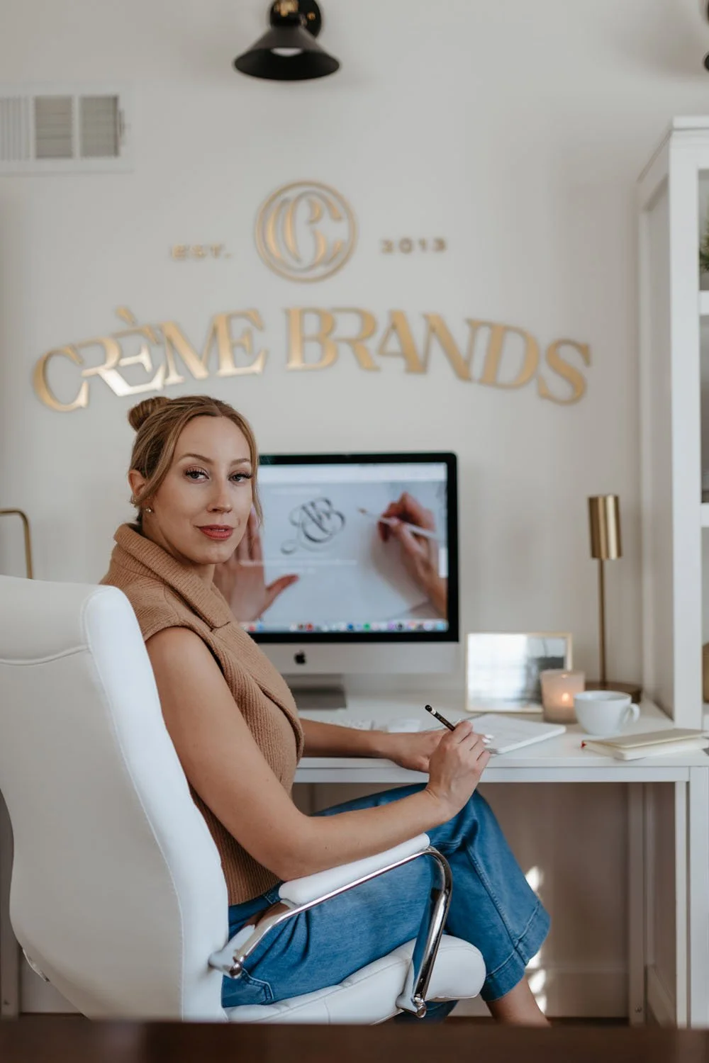 Kathryn Joachim smiling at her desk