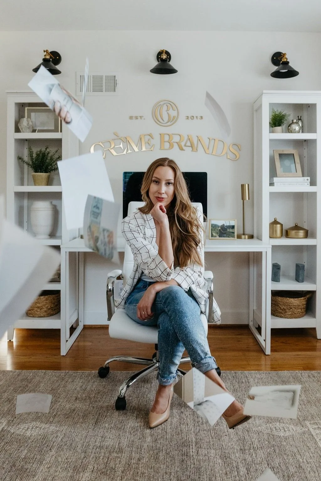 Kathryn Joachim headshot with papers flying around in the air