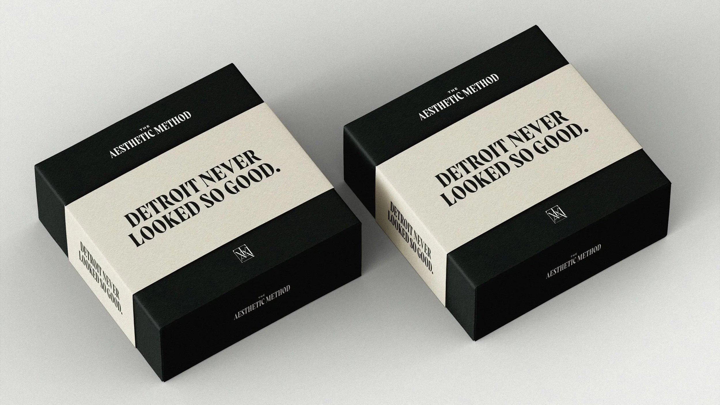 black boxes with white "Detroit never looked so good." belly bands