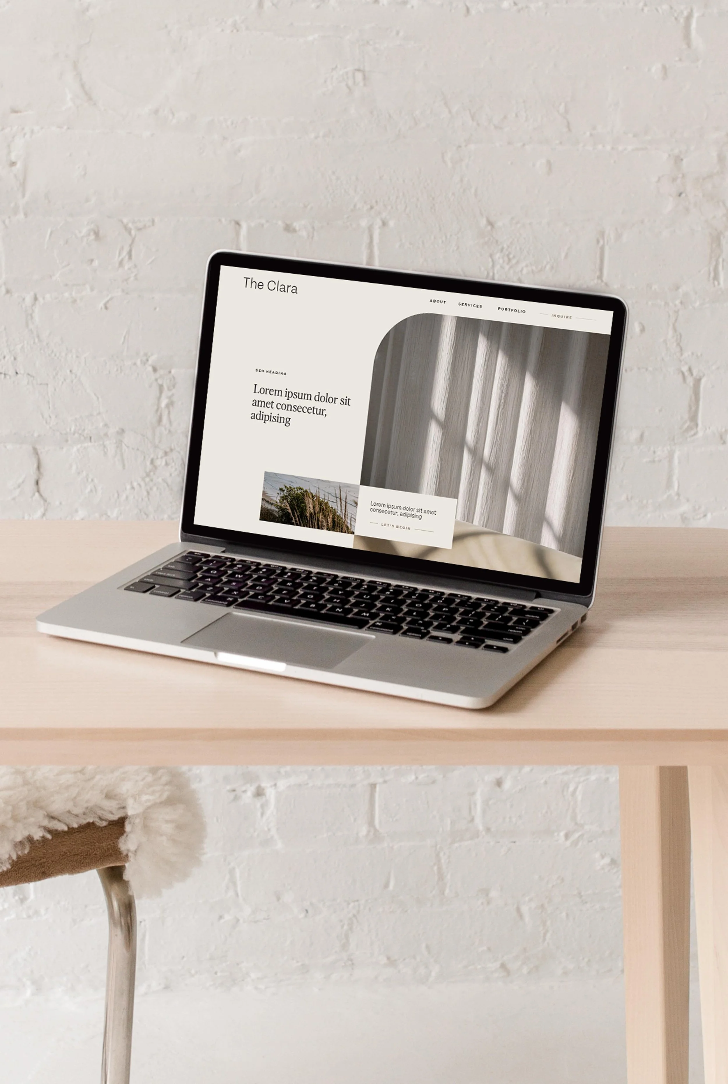 laptop displaying the hero section of The Clara website design