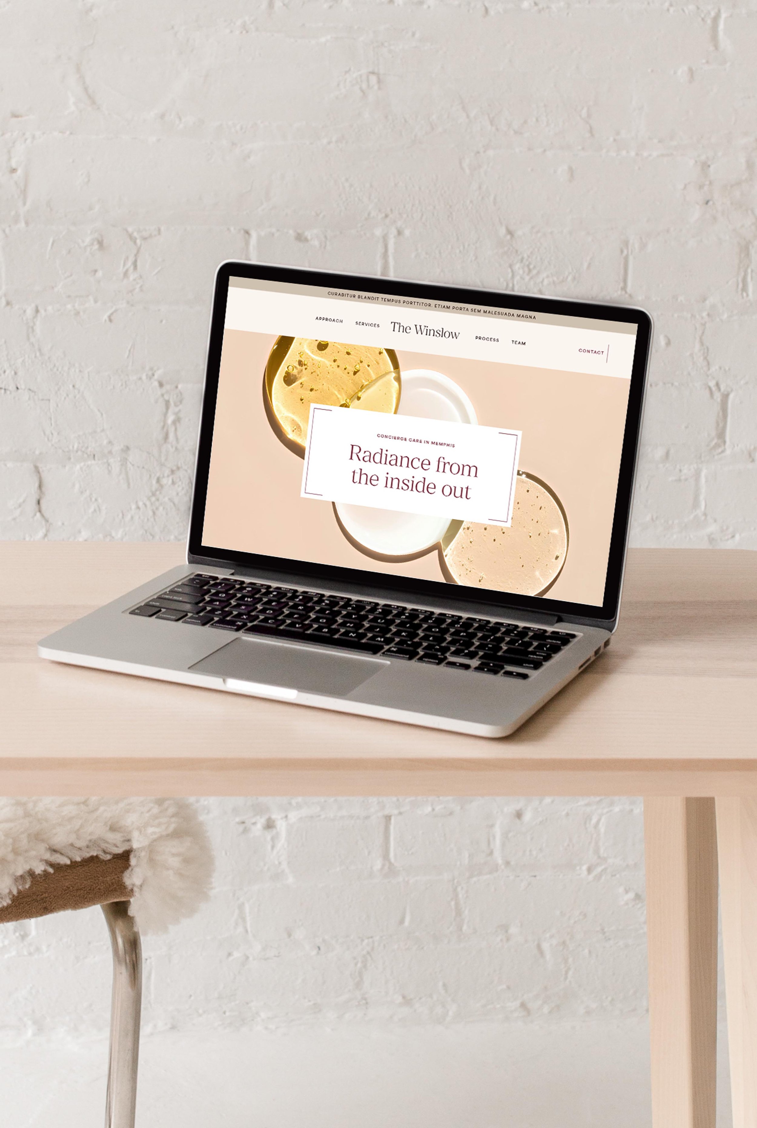 laptop displaying the hero section of the website design