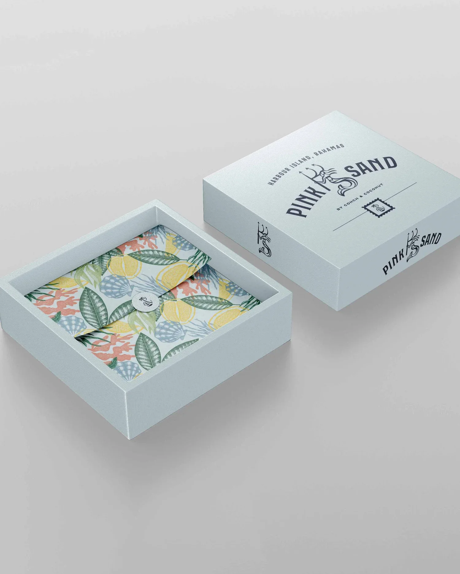 Pink Sand custom packaging with a box, tissue paper, and sticker